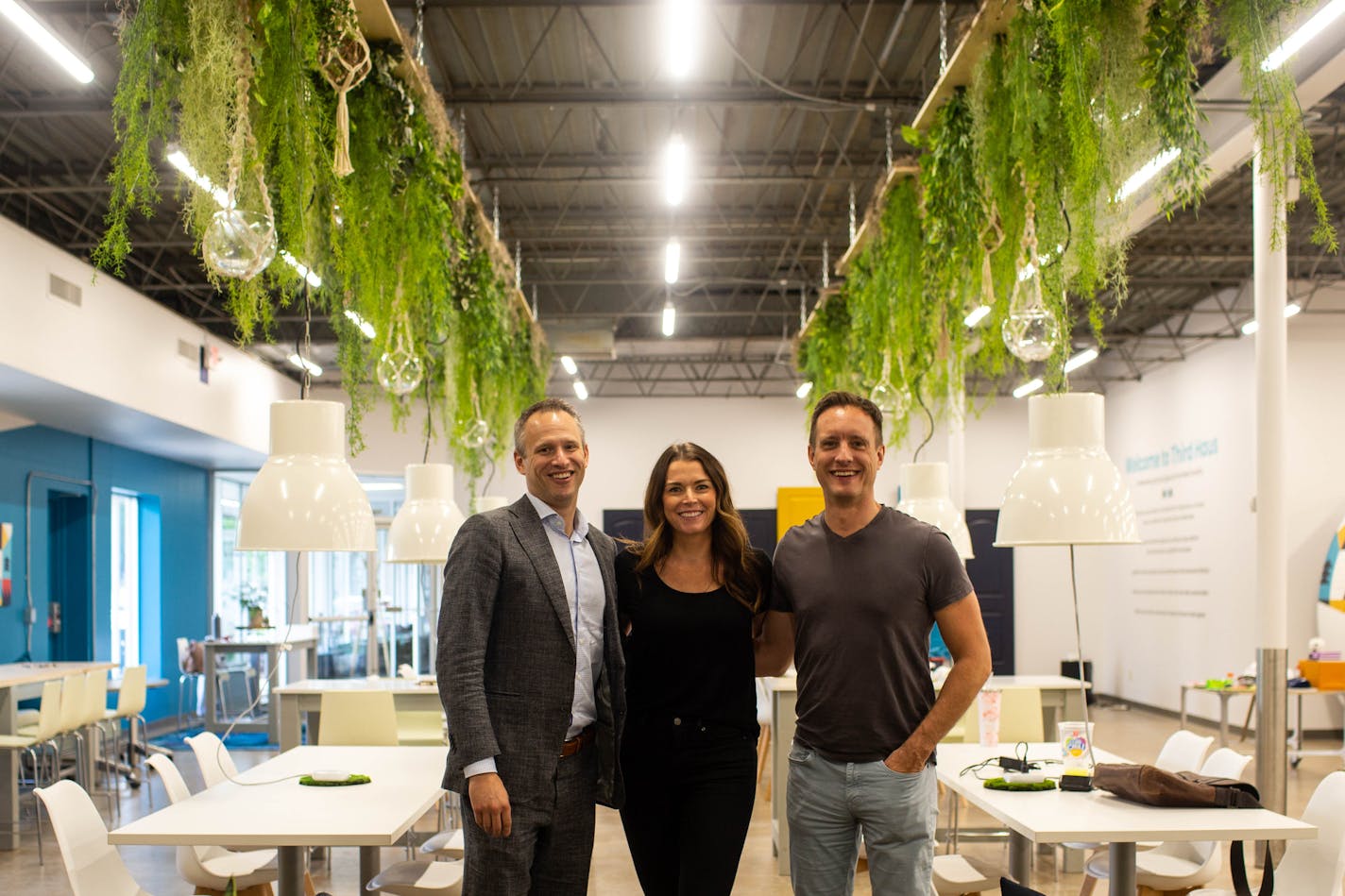 Chris Walton, left, and Anne Mezzenga, co-founders and co-CEOs of Third Haus co-working lab, and Troy Stelzer, CEO of Xenia Retail, are in the new co-working space lab in Minneapolis' Linden Hills neighborhood.