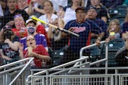 Fans try to avoid a bat that slipped out of the hands of Drew Waters (6) of the Kansas City Royals in the third inning Wednesday, September 14, 2022, 