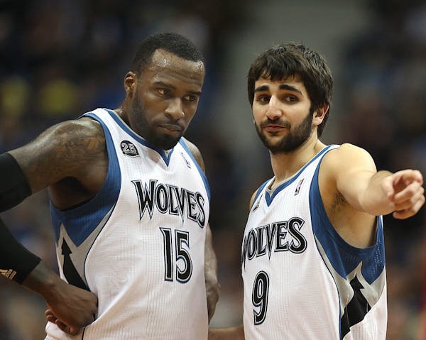 Ricky Rubio (9) and Shabazz Muhammad of the Minnesota Timberwolves talk things over as they face the Portland Trail Blazers on Saturday, FEb. 8, 2014,