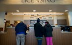Residents filled out licensing requests at the Richfield City Hall on in January 2014.