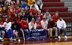 Michael Walker posted on Facebook a photograph of fans in Jordan with a Trump flag draped over the legs of four front-row spectators.