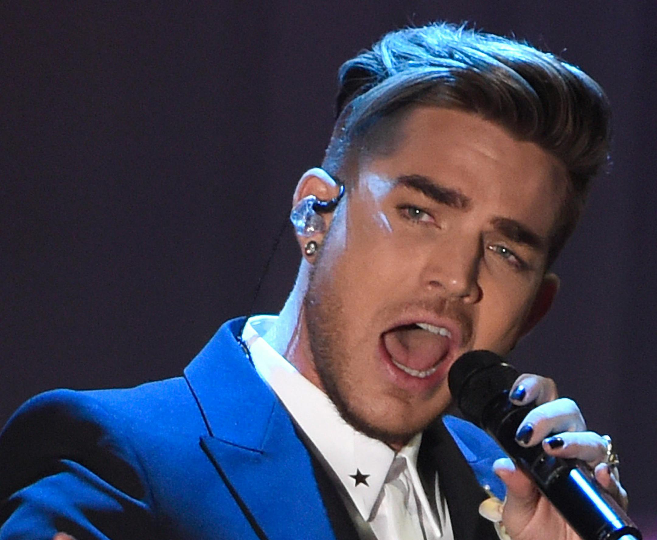 Adam Lambert performs at the 2016 Clive Davis Pre-Grammy Gala at the Beverly Hilton Hotel on Sunday, Feb. 14, 2016, in Beverly Hills, Calif. (Photo by Chris Pizzello/Invision/AP)