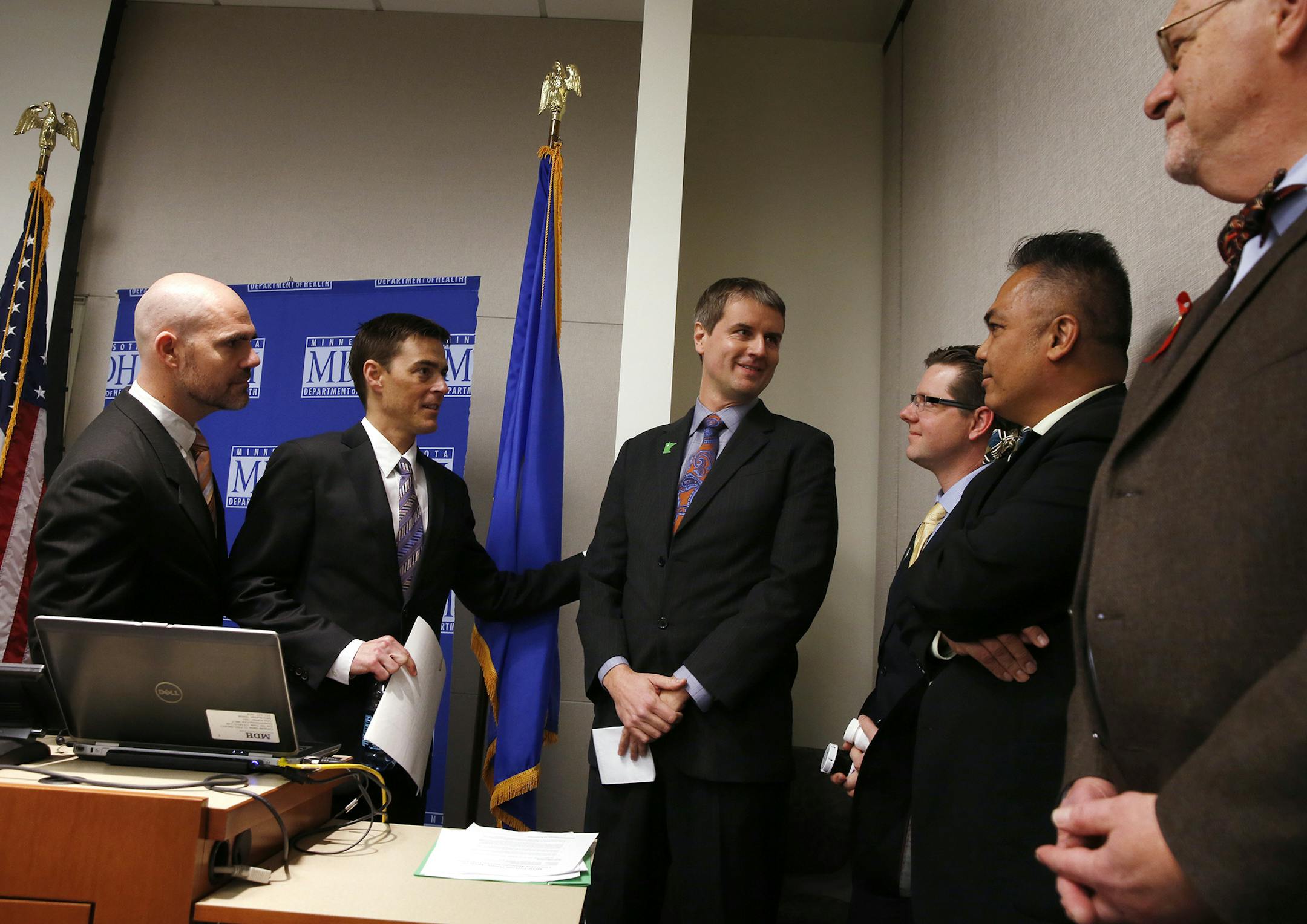 Dr. Gary Starr, from left, co-founder of LeafLine Labs and his partner Dr. Andrew Bachman, Dr. Kyle Kingsley, CEO of Minnesota Medical Solutions and their scientific director Dr. Jon Thompson stand with Minnesota Department of Health assistant commissioner Manny Munson-Regala and commissioner Dr. Ed Ehlinger during a press conference announcing that the two companies will become the sole manufacturers responsible for growing, processing and distributing medical cannabis products in the state at