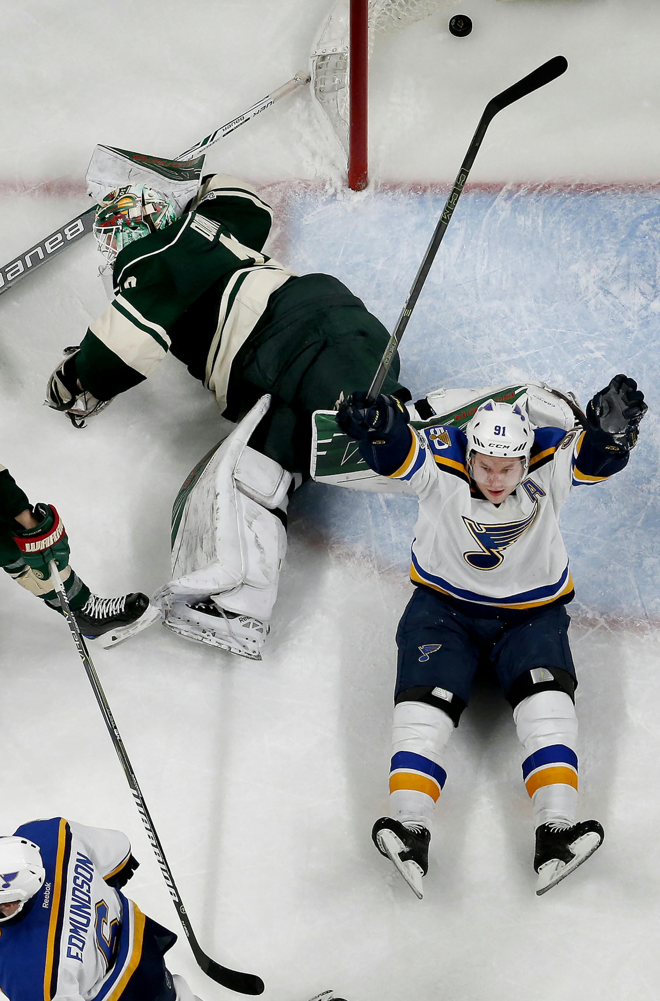 Joel Edmundson (6) and Vladimir Tarasenko (91) after Edmundson shot the puck past Minnesota Wild goalie Devan Dubnyk to win the game in overtime. ] CARLOS GONZALEZ ï cgonzalez@startribune.com - April 12, 2017, St. Paul, MN, Xcel Energy Center, NHL, Stanley Cup Playoffs, Game 1, Minnesota Wild vs. St. Louis Blues