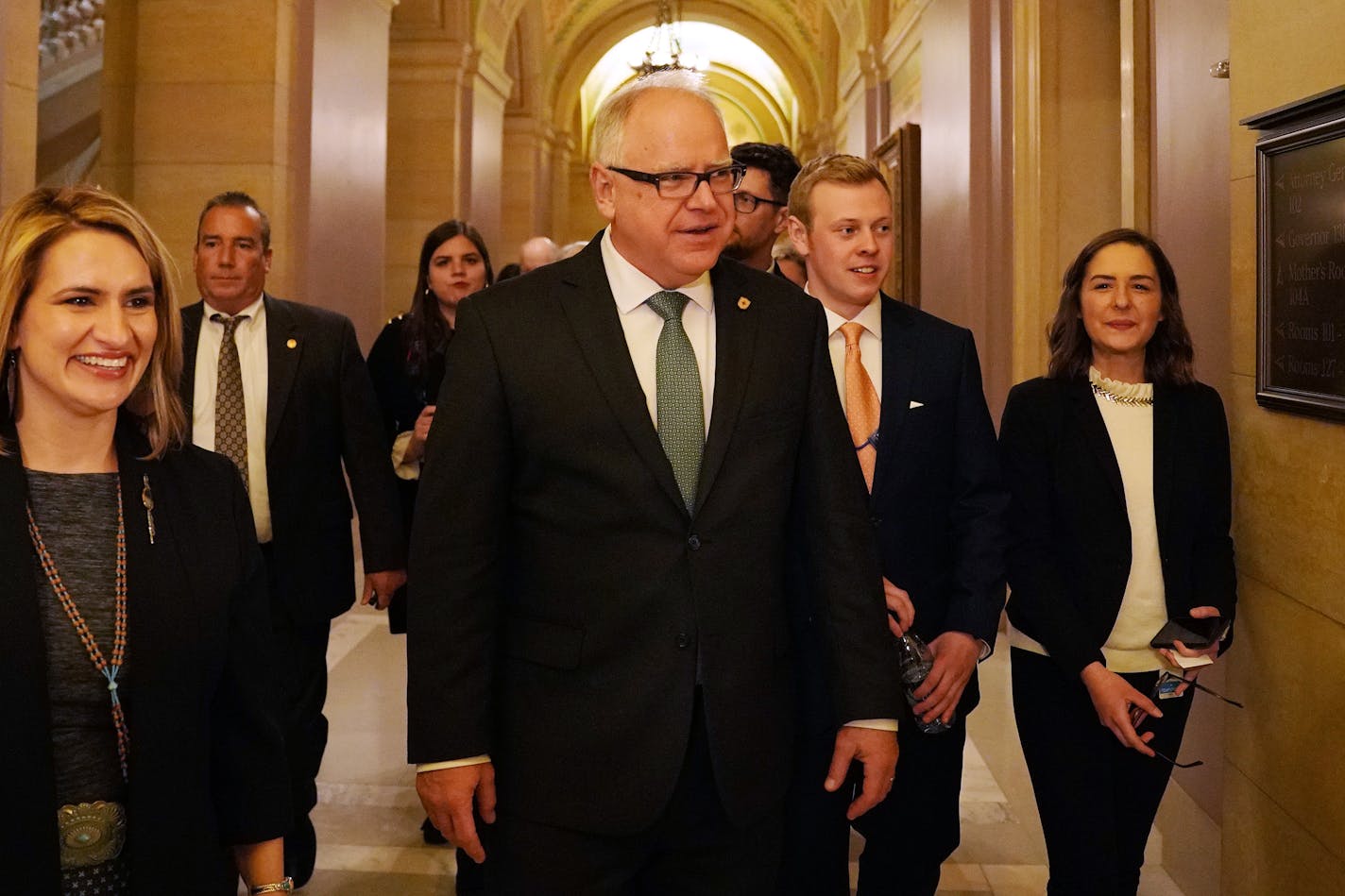 Gov. Tim Walz and Lt. Gov. Peggy Flanagan walked with their team to a public reception in the rotunda at the State Capitol St. Paul.