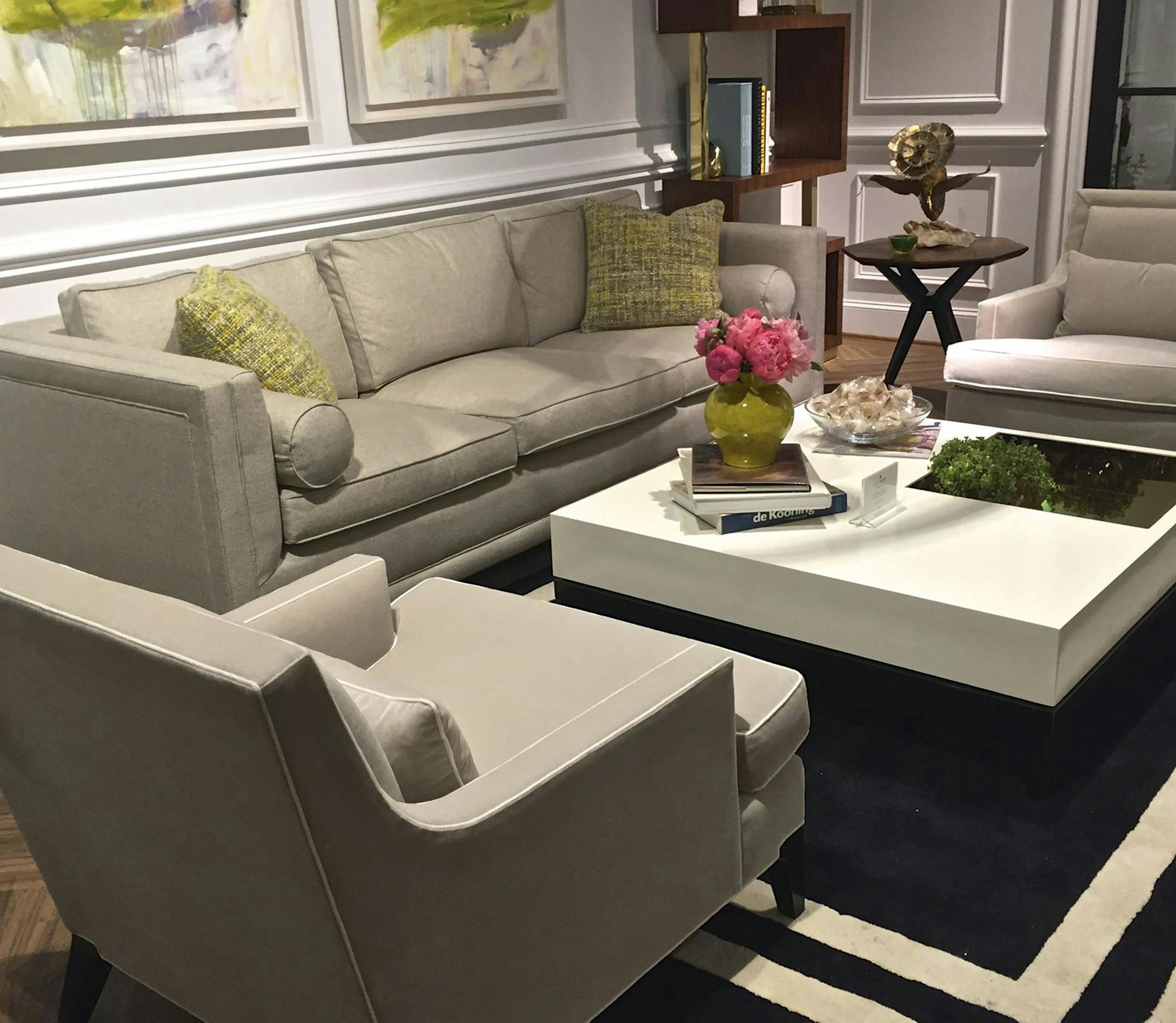 Downing coffee table in pantone cream with onyx base surrounded by owning sofa and arm chairs by Kate Spade Home. The rug is also from the Kate Spade Home collection. (Patricia Sheridan/Pittsburgh Post-Gazette/TNS) ORG XMIT: 1176021