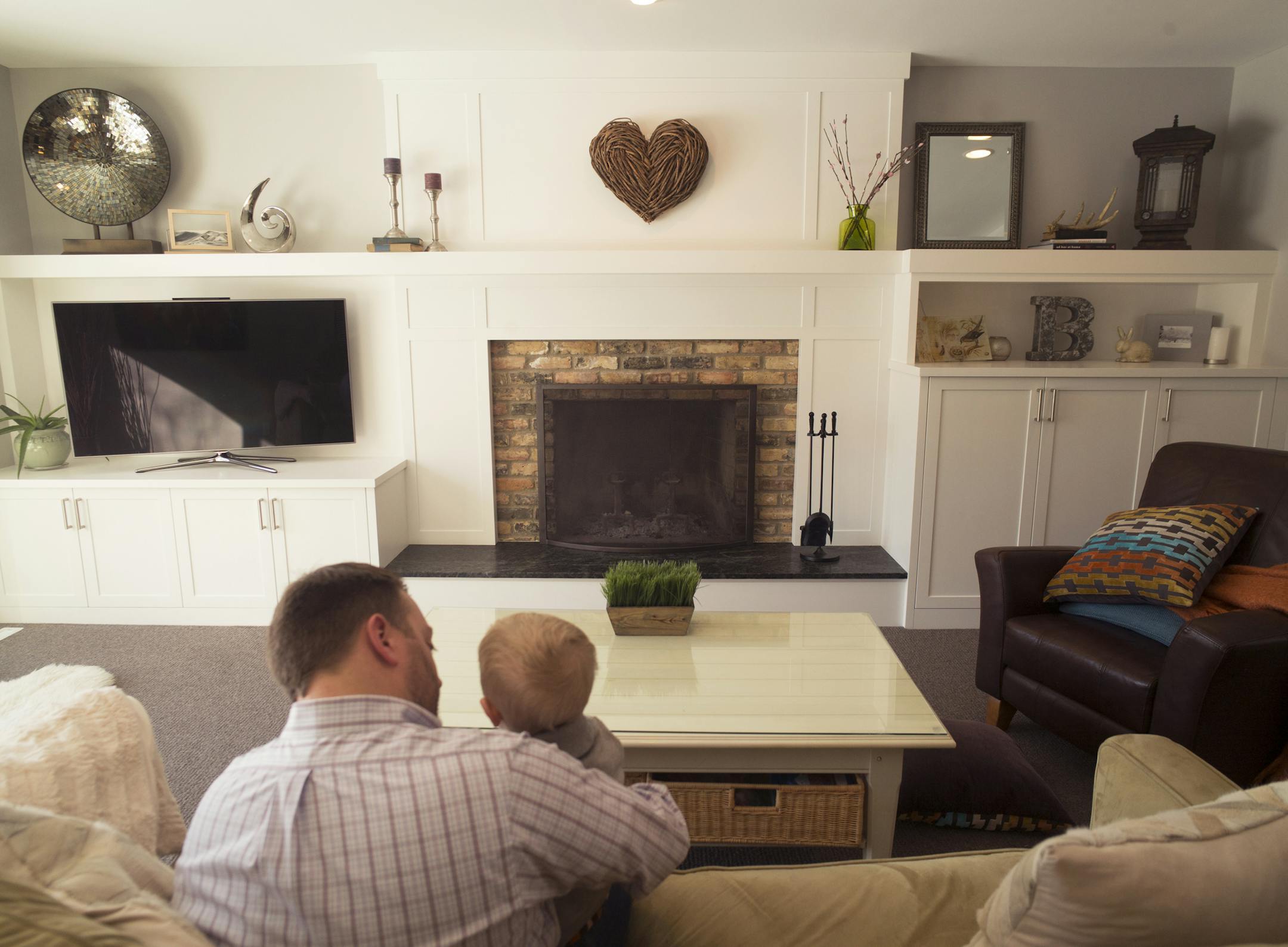 Angela and Ricky Brown show off their remodeled home, the one Ricky grew up in. The living room retained the old fire place in spite of a total remodel.]Richard Tsong-Taatarii/rtsong-taatarii@startribune.com