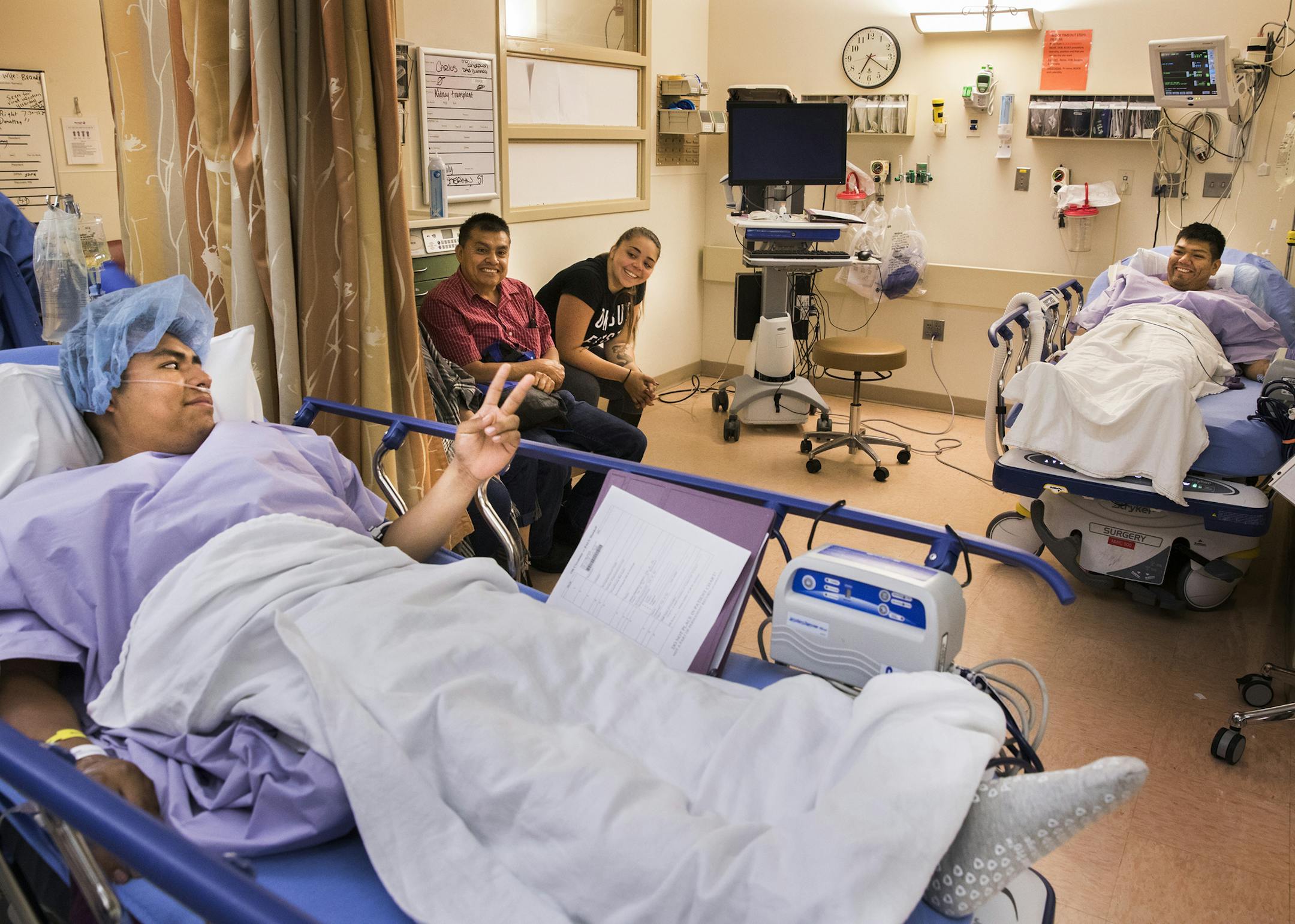 Jeremy, left, the donor, says goodbye to his brother Carlos, right, the recipient, before he is wheeled into the operating room. ] LEILA NAVIDI ï leila.navidi@startribune.com BACKGROUND INFORMATION: Jeremy Villafan Priego donates a kidney to his brother Carlos Villafan Priego, who has been on dialysis for years, in a surgery performed at University of Minnesota Medical Center in Minneapolis on Thursday, September 14, 2017. Both brothers are DACA recipients. Carlos has his health coverage th