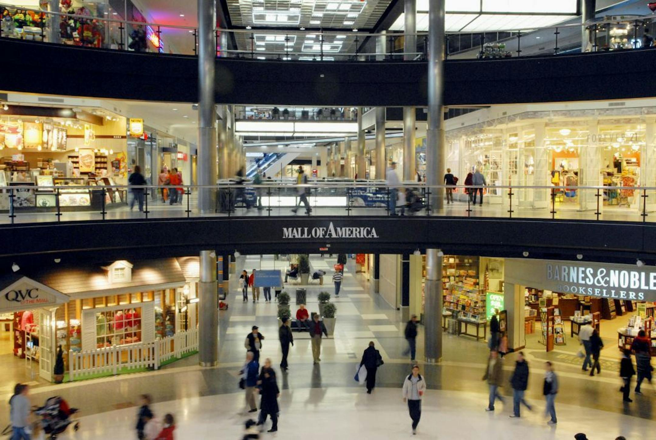 FILE - In this Feb. 8, 2008 file photo, shoppers walk about in the Mall of America in Bloomington, Minn. The largest shopping mall in the country is targeting workers in one of the nation's top oil-producing areas. A YouTube advertisement for the Mall of America depicts an oil worker from western North Dakota visiting the mall and an area hotel to meet up with his family for the weekend. It's the first time the mall has used social media for a marketing campaign geared toward a specific audience