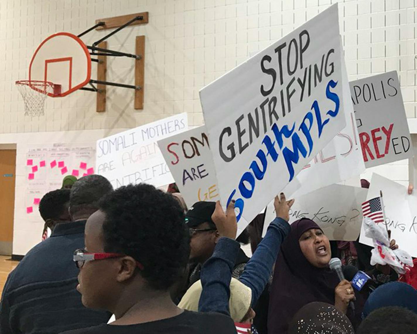 Opponents of the proposed market chanted "We are not for sale" and "people over profits" on Friday night.