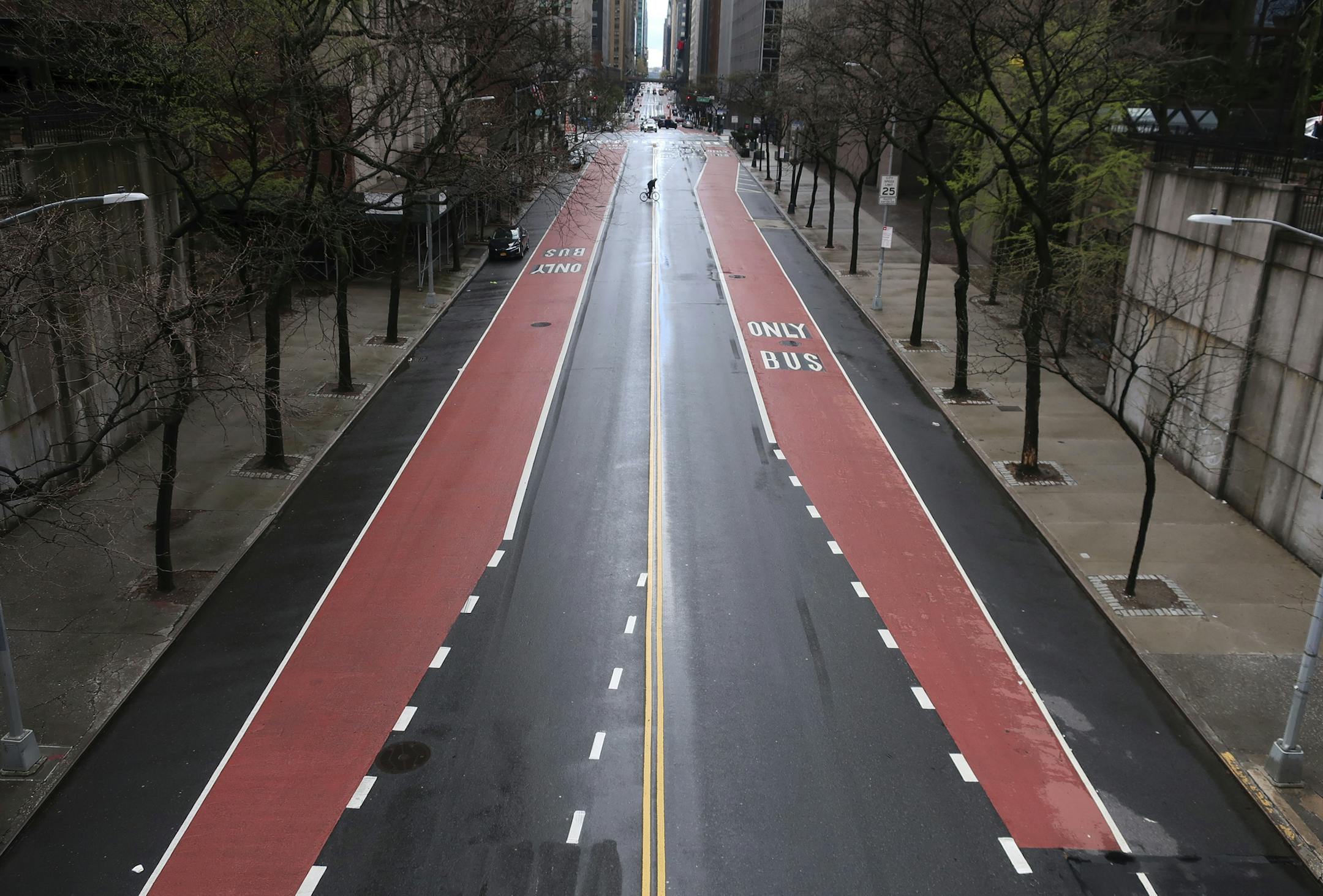 FILE - In this April 21, 2020, file photo, 42nd Street in New York has very little traffic. The world cut its daily carbon dioxide emissions by 17% at the peak of the pandemic shutdown last month, a new study found. But with life and heat-trapping gas levels inching back toward normal, the brief pollution break will likely be "a drop in the ocean" when it comes to climate change, scientists said. (AP Photo/Ted Shaffrey, File)