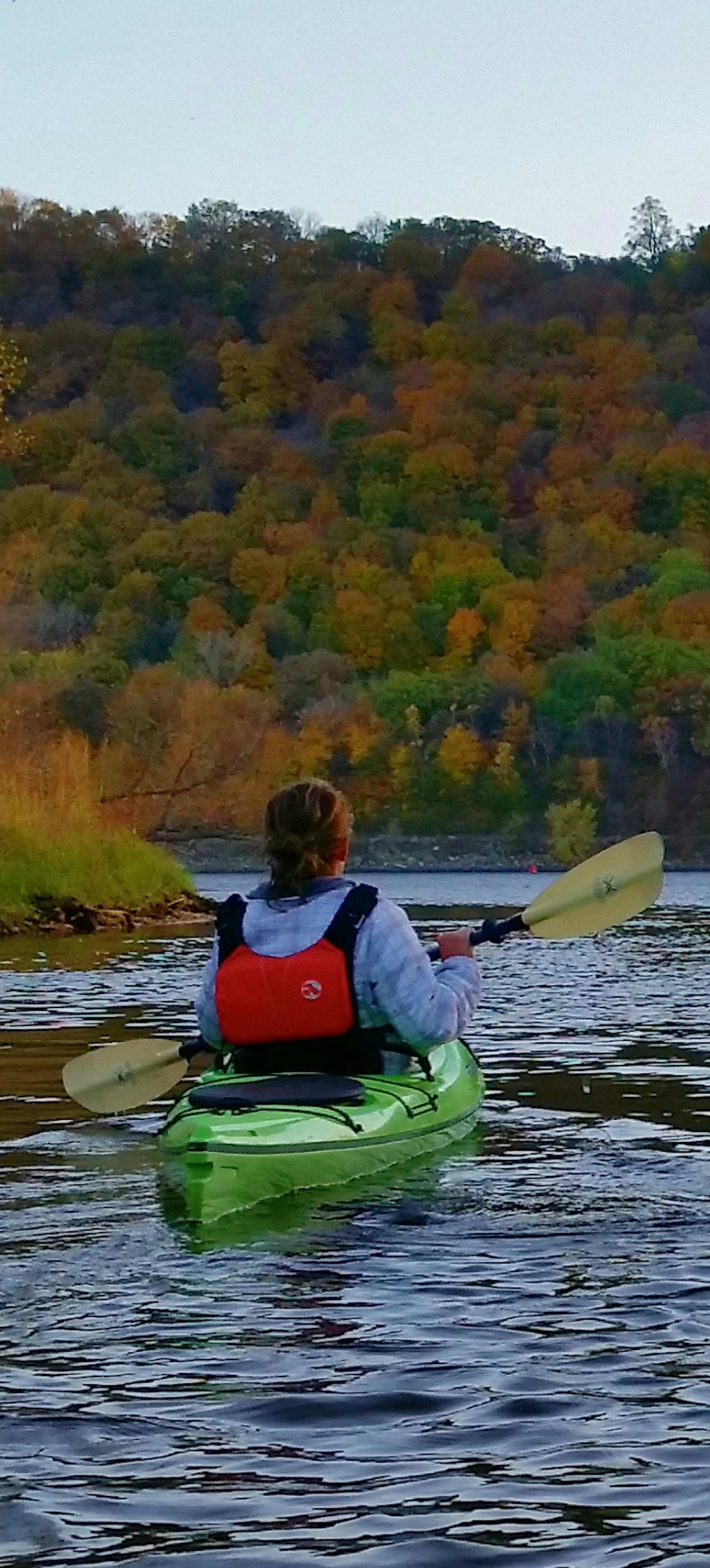 Kayakers paddle down the Mississippi River. Courtesy of Broken Paddle Guiding