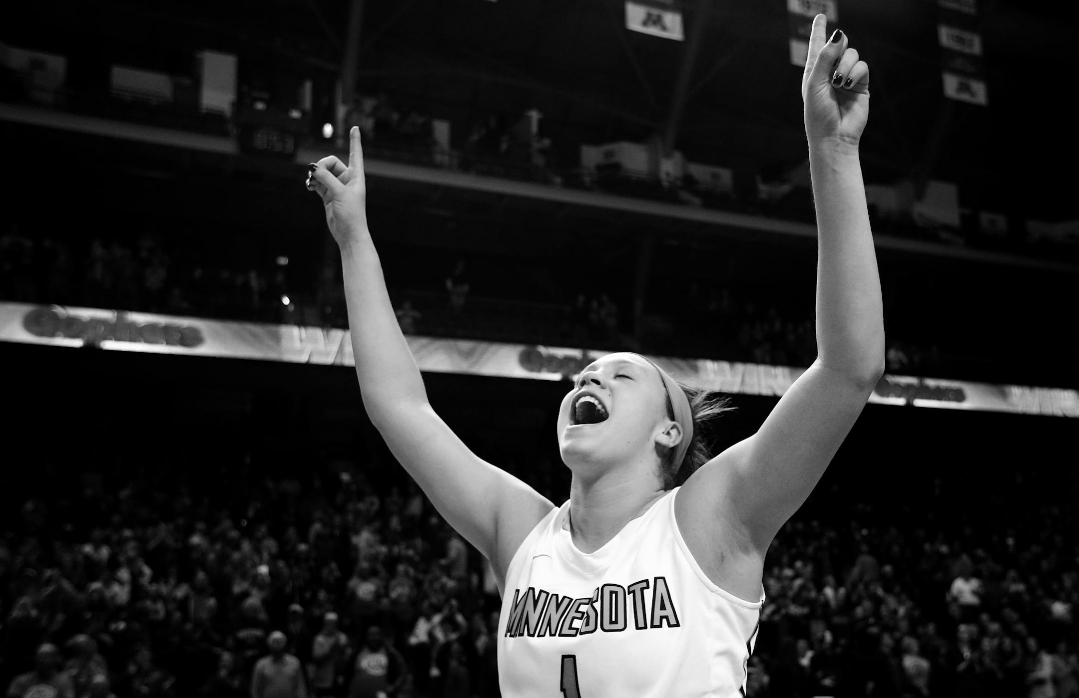 Rachel Banham (1) celebrated at the end of the game. Banham made a buzzer beating three pointer at the end of the game. Minnesota beat Iowa by a final score of 78-76. Banham finished with 35 points.