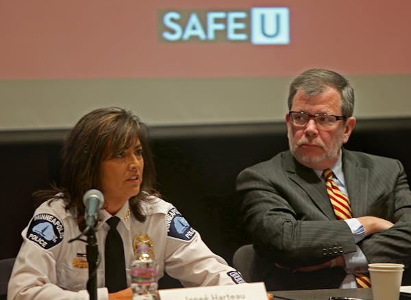 Minneapolis Police Chief Jane&#xe9; Harteau, left, and University of Minnesota President Eric Kaler talked to a panel of university, county, state and