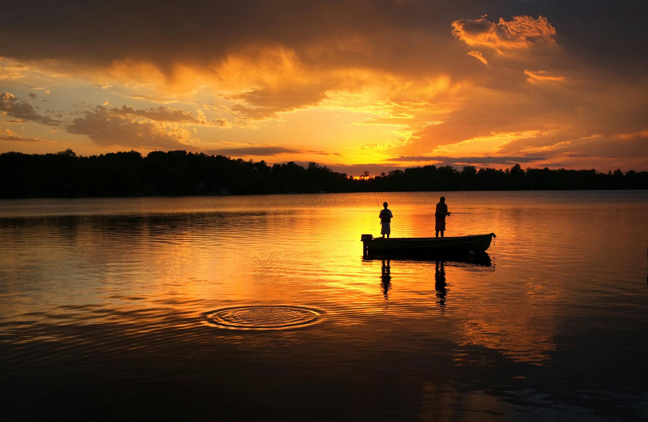 Brendan Peterson and Tyler Grondseth try their luck on a hot fishing hole on Lake Elora in Northern Minnesota.