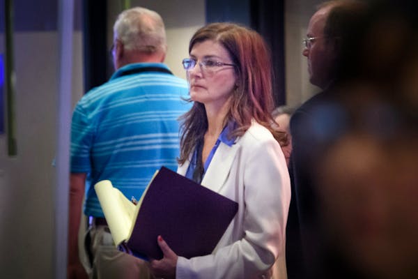 Michelle MacDonald waited in the back of the convention hall before the convention debated whether she would be allowed to speak as the Minnesota GOP 