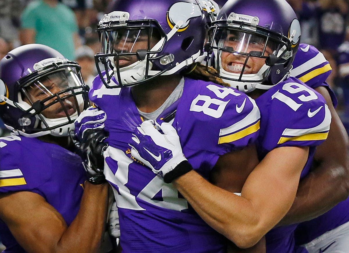 Minnesota Vikings wide receiver Adam Thielen (19) right celebrated with Cordarrelle Patterson (84) after he ran a 108 yard touchdown back in the secon