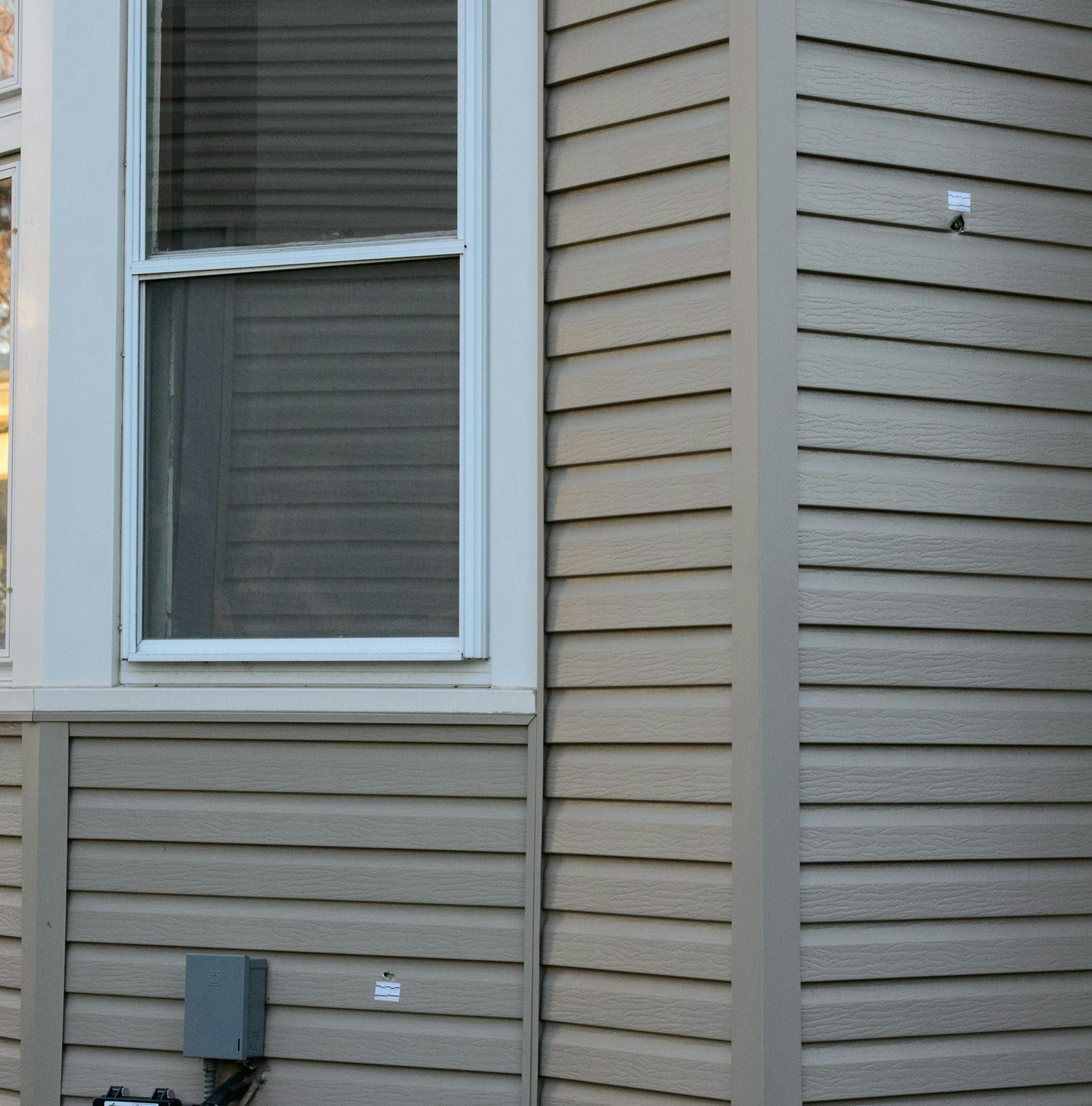 Multiple bullet holes could be seen in the home next to Bill Bobick's where a Minneapolis man was shot by St. Paul police.