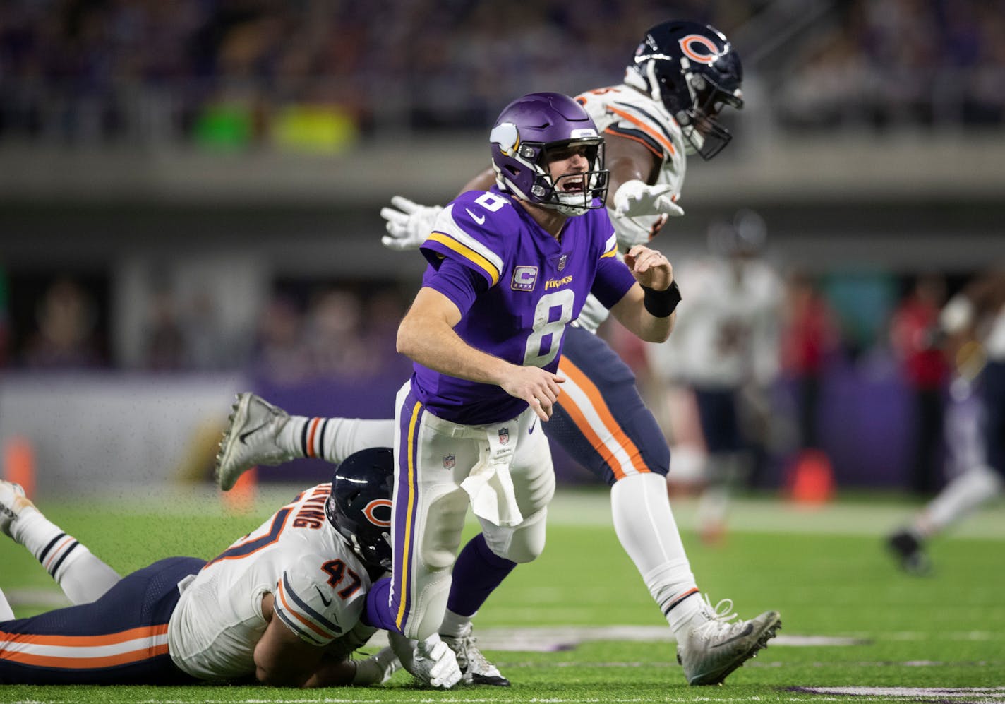 Vikings quarterback Kirk Cousins was pressured late in the fourth quarter by Chicago Bears linebacker Isaiah Irving.