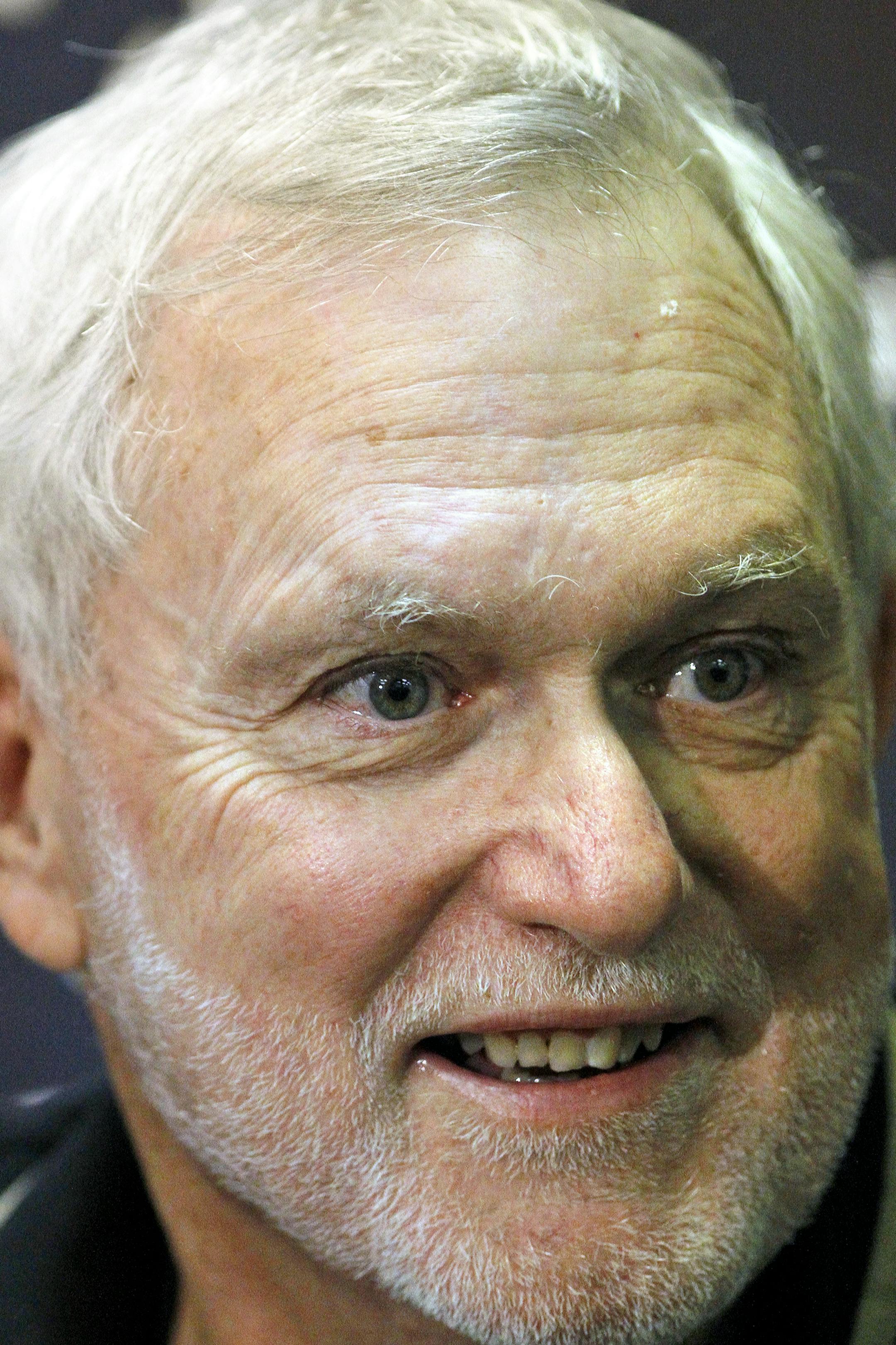 In a Thursday, November 4, 2010 photo, former New Orleans Saints kicker Tom Dempsey speaks with the media at the Saints' practice facility in Metairie, La. Dempsey, who played in the NFL despite being born without toes on his kicking foot and made a record 63-yard field goal, died late Saturday, April 4, 2020 while struggling with complications from the new coronavirus, his daughter said. He was 73 years old. (Brett Duke/The Advocate via AP)