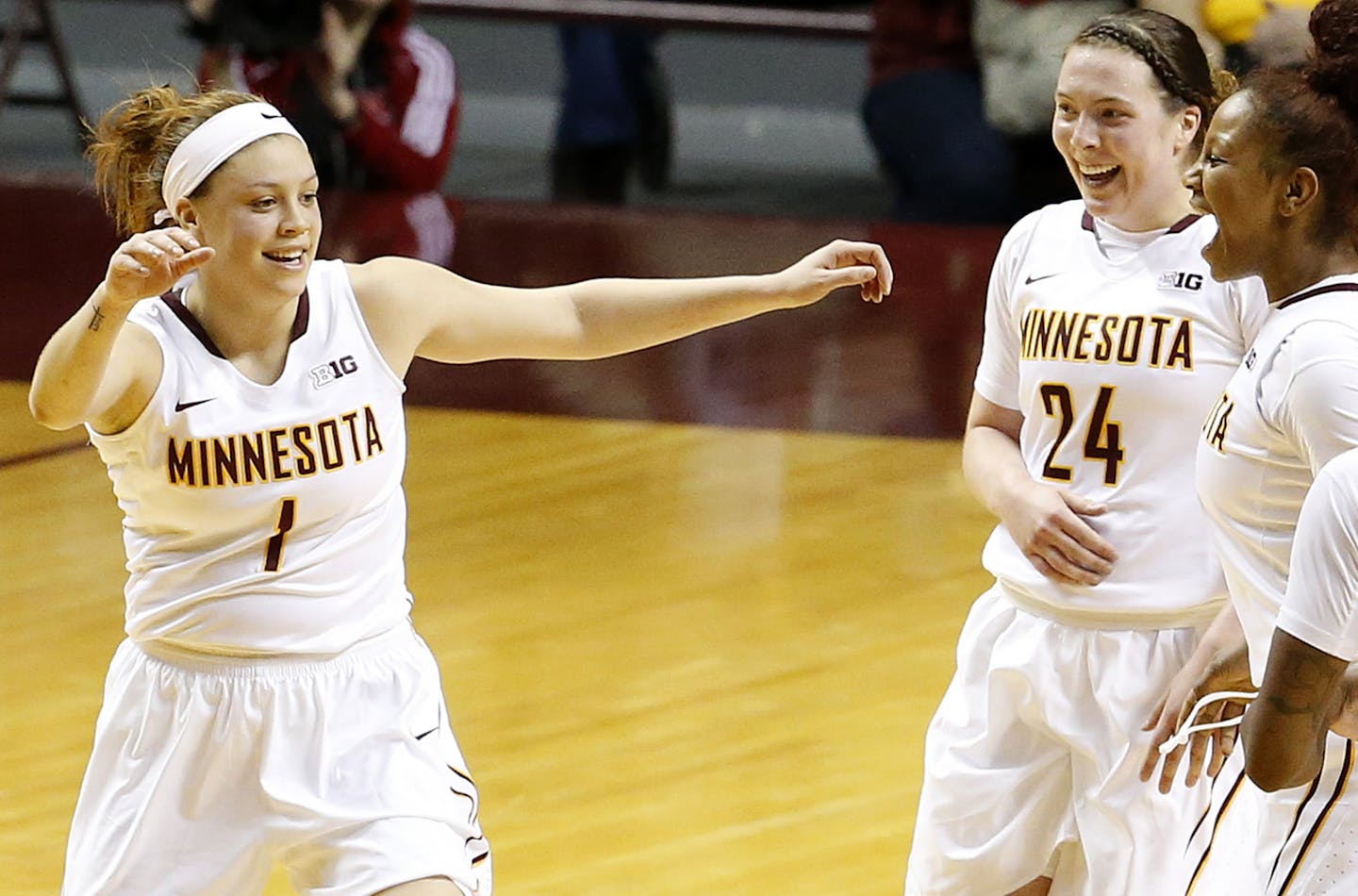 Rachel Banham (1), Mikayla Bailey (24) and Allina Starr (15) celebrated after a play during a game earlier this season.