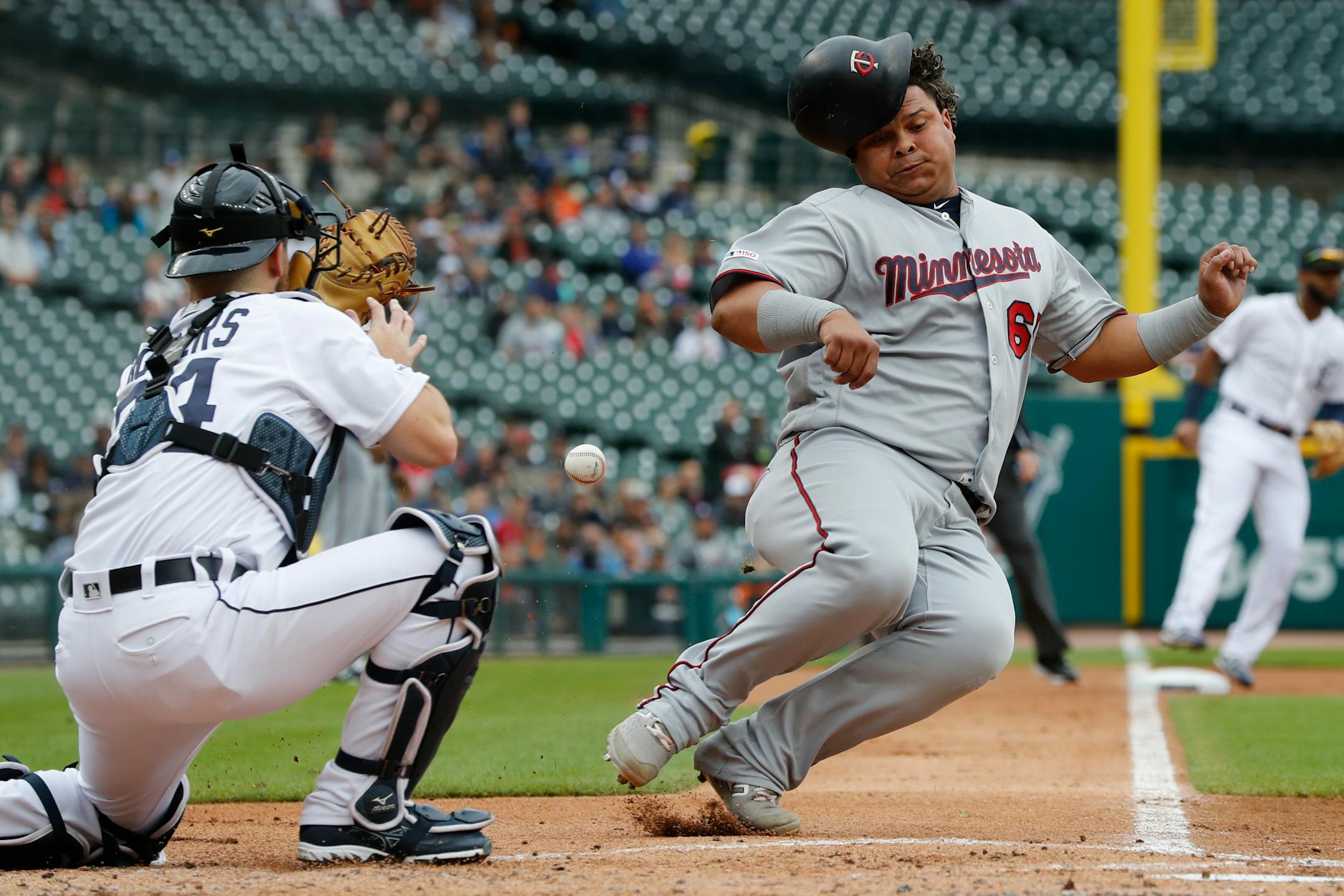 Willians Astudillo beat the throw to Tigers catcher Jake Rogers to score from second on a single by teammate Jorge Polanco during the second inning of the Twins' 8-3 victory over the Tigers on Sunday.