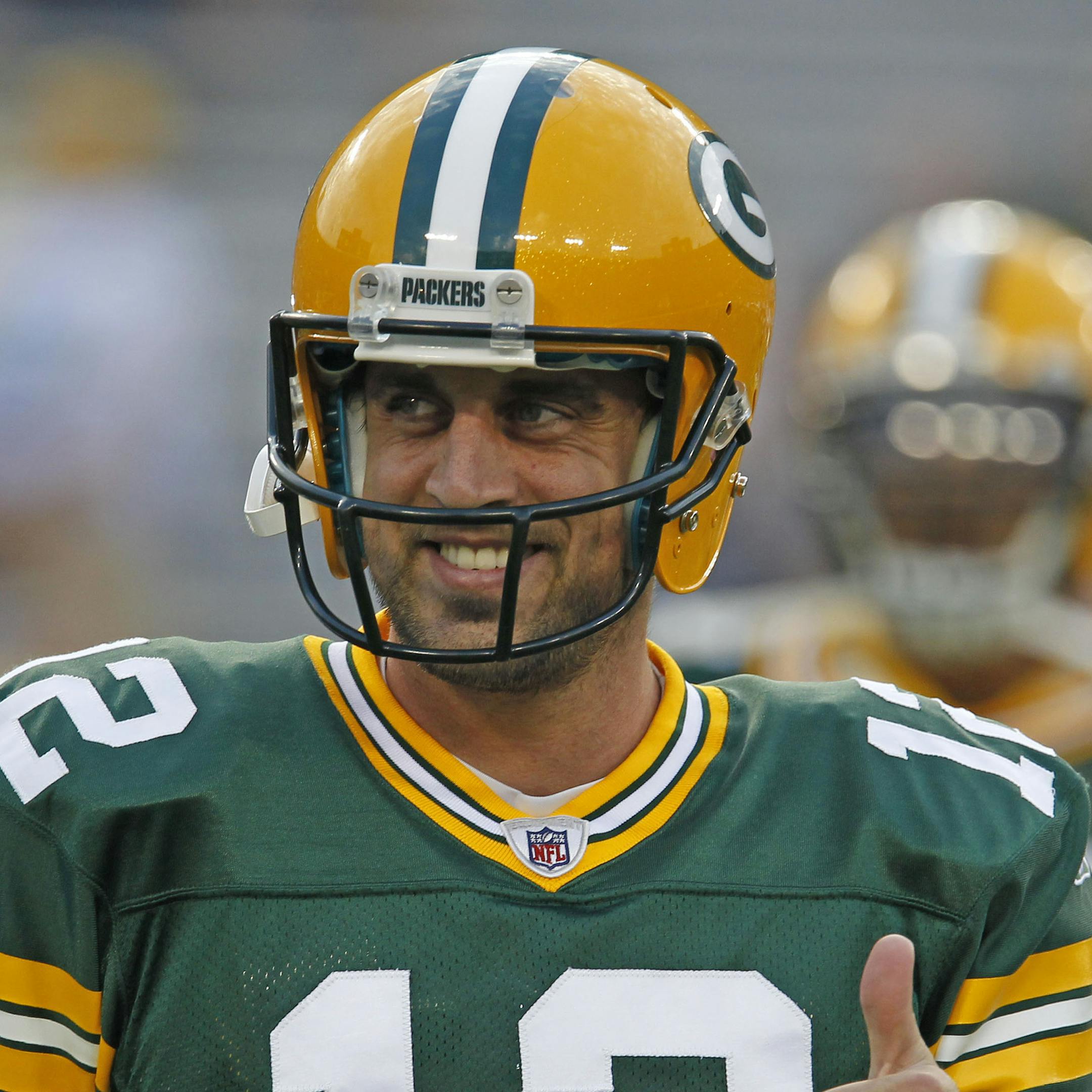 Green Bay Packers quarterback Aaron Rodgers gives a thumbs up to fans prior to an NFL football game against the Kansas City Chiefs Thursday, Sept. 1, 2011, in Green Bay, Wis. (AP Photo/Matt Ludtke)