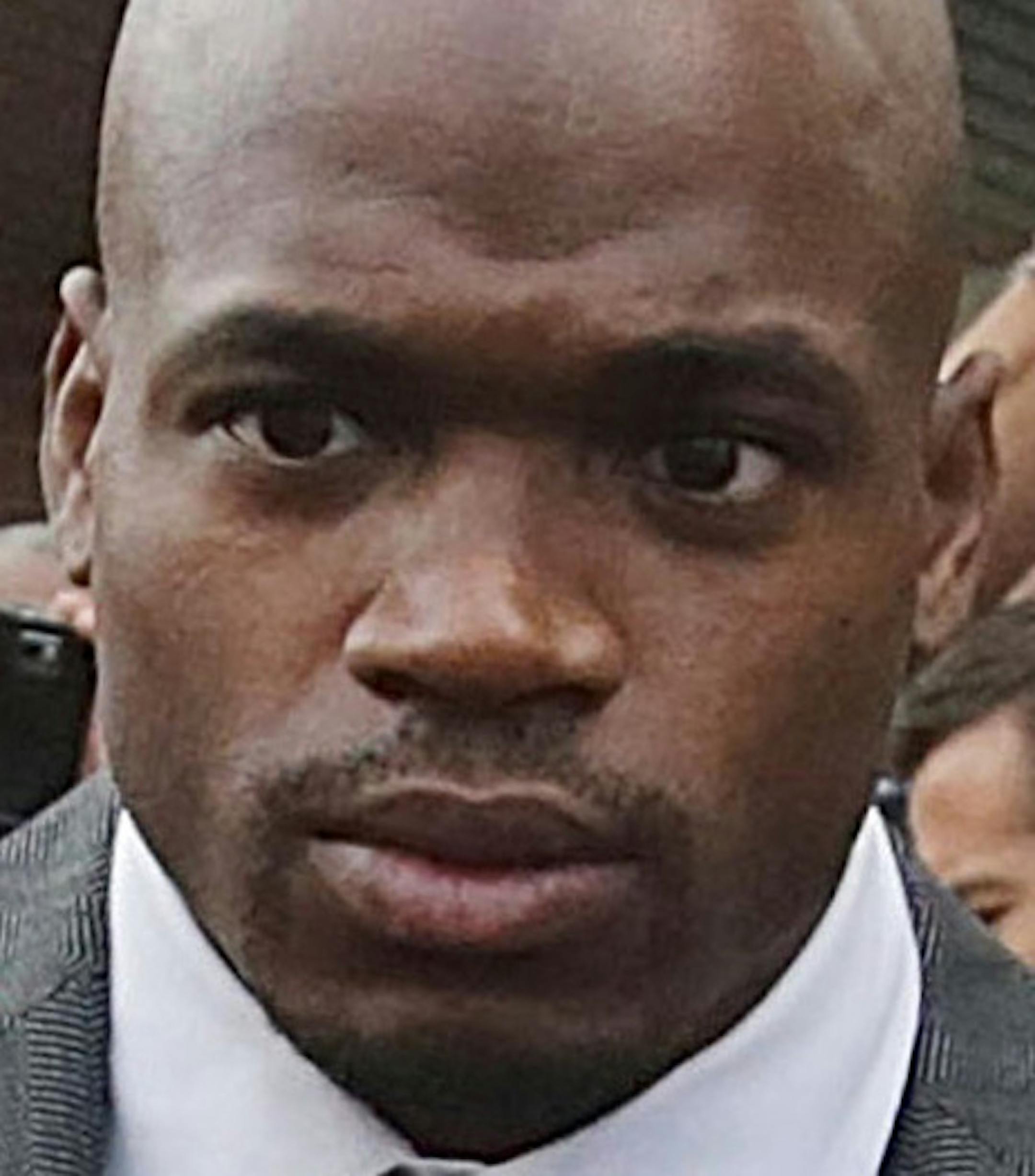 FILE - In this Oct. 8, 2014, file photo, Minnesota Vikings running back Adrian Peterson leaves court accompanied by his wife, Ashley Brown Peterson, in Conroe, Texas. The NFL suspended Adrian Peterson without pay for at least the remainder of the season. The league said Tuesday, Nov. 18, 2014, it informed the Minnesota Vikings running back he will not be considered for reinstatement before April 15 for violating the NFL personal conduct policy. (AP Photo/Houston Chronicle, Billy Smith II, File)