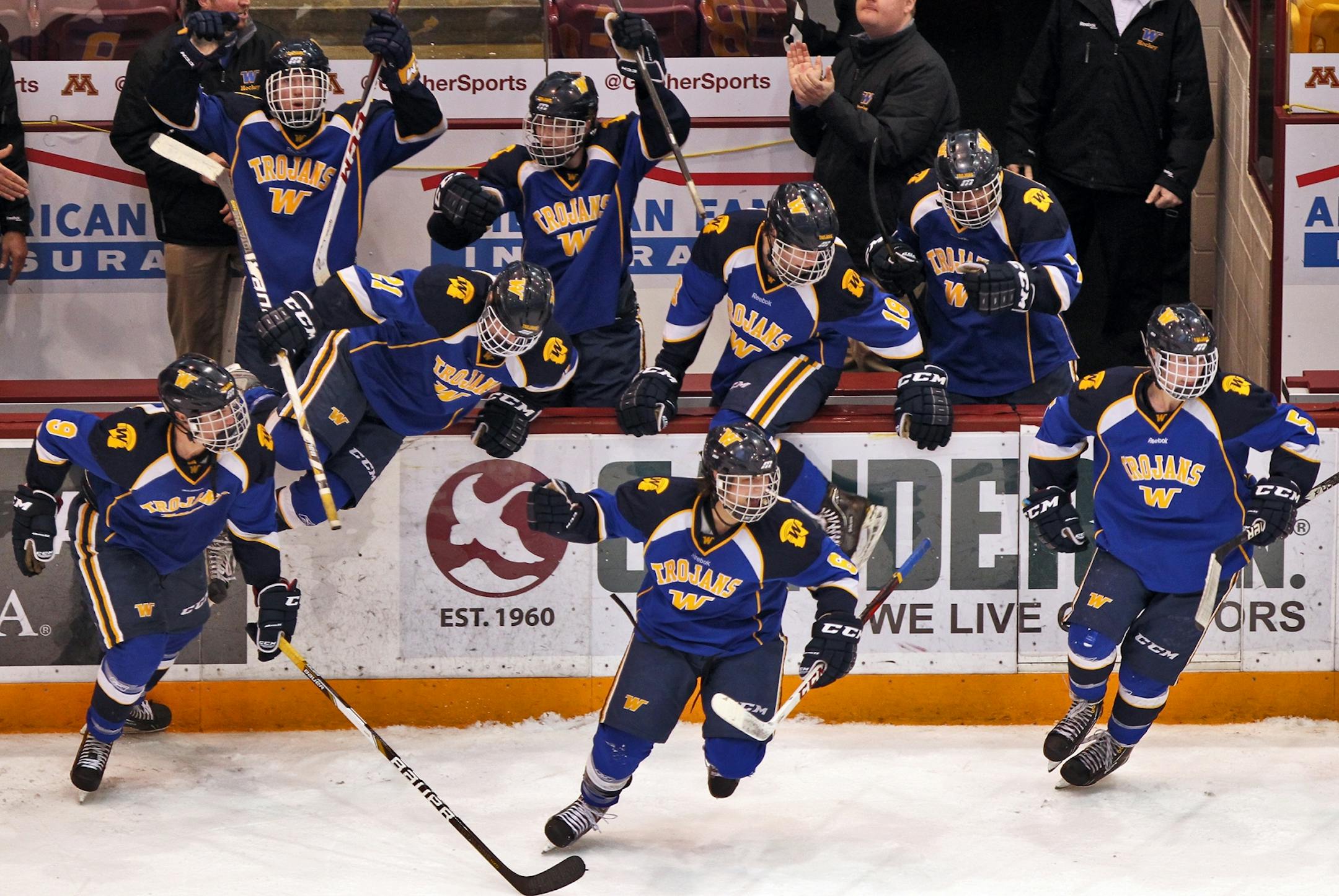 Wayzata players started to celebrate after the Trojans knocked off defending Class 2A champion Benilde-St. Margaret's 5-2 in the Section 6 boys' hockey title game at Mariucci Arena on Wednesday night.