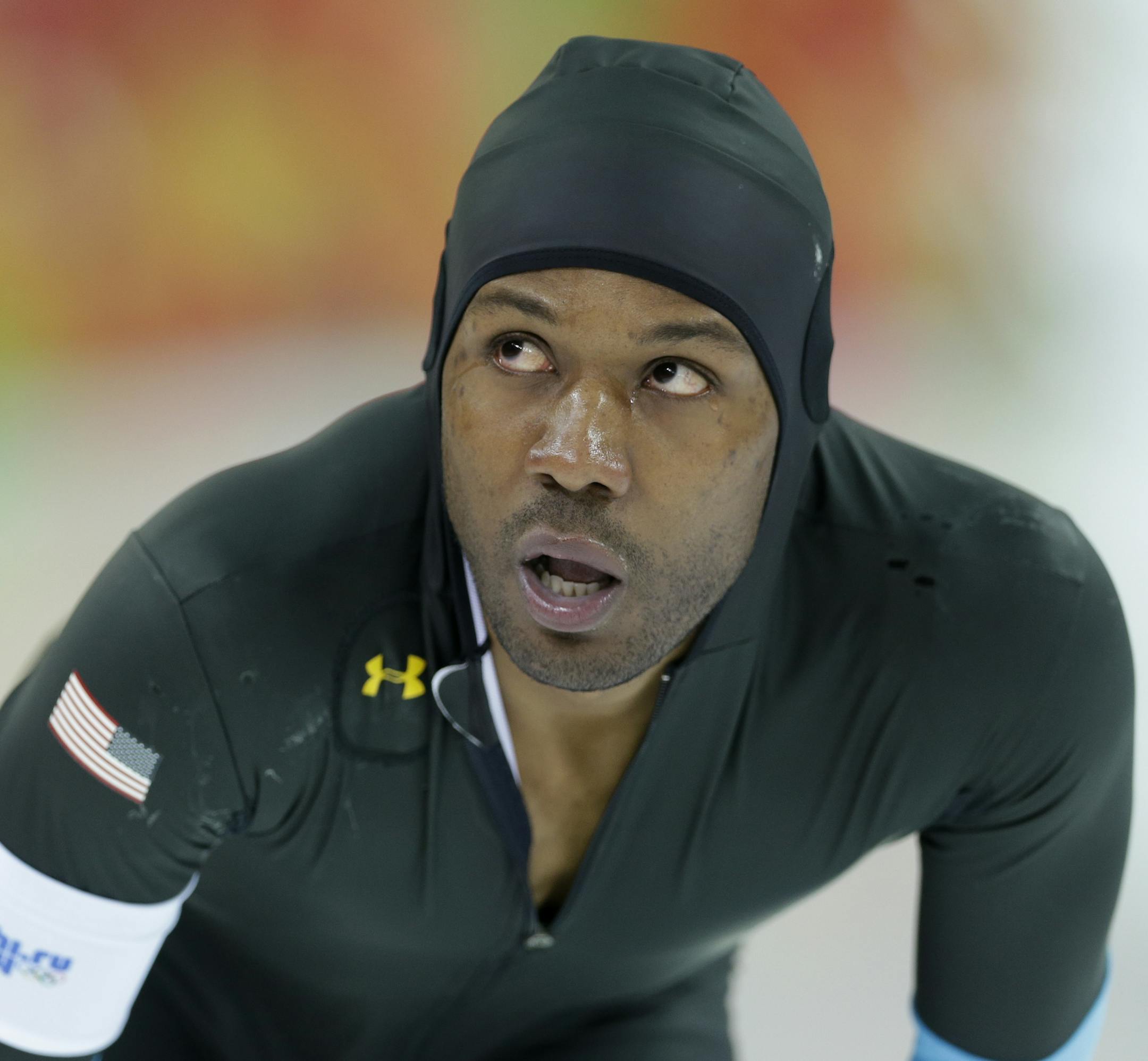 Shani Davis of the U.S. looks at the scoreboard after racing in the men's 1,500-meter speedskating at the Adler Arena Skating Center during the 2014 Winter Olympics in Sochi, Russia, Saturday, Feb. 15, 2014. (AP Photo/Patrick Semansky)