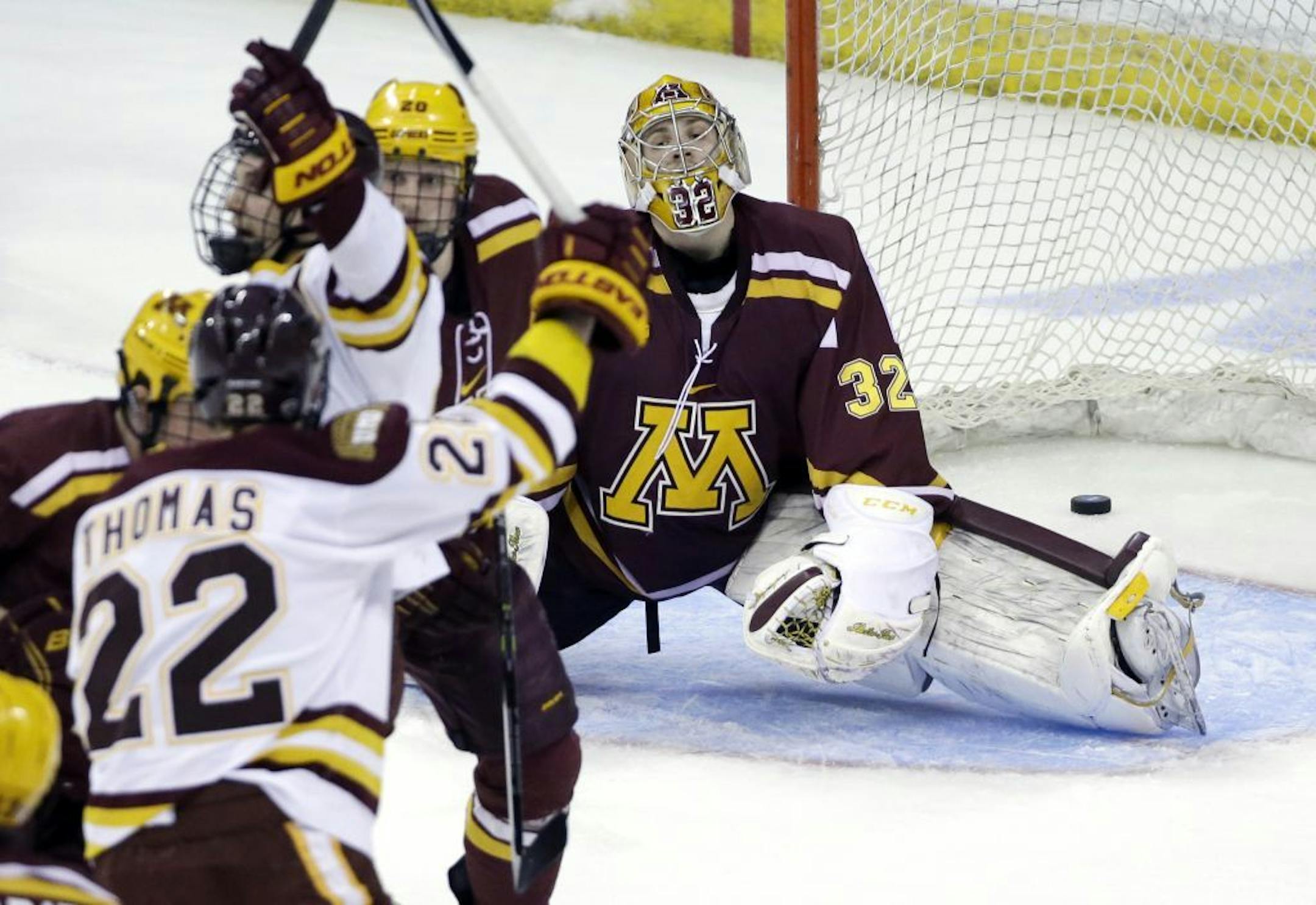 Minnesota goaltender Adam Wilcox (32) reacts after a goal by Minnesota Duluth is scored in the first period of an NCAA college hockey regional semifinal game in Manchester, N.H., Friday, March 27, 2015.