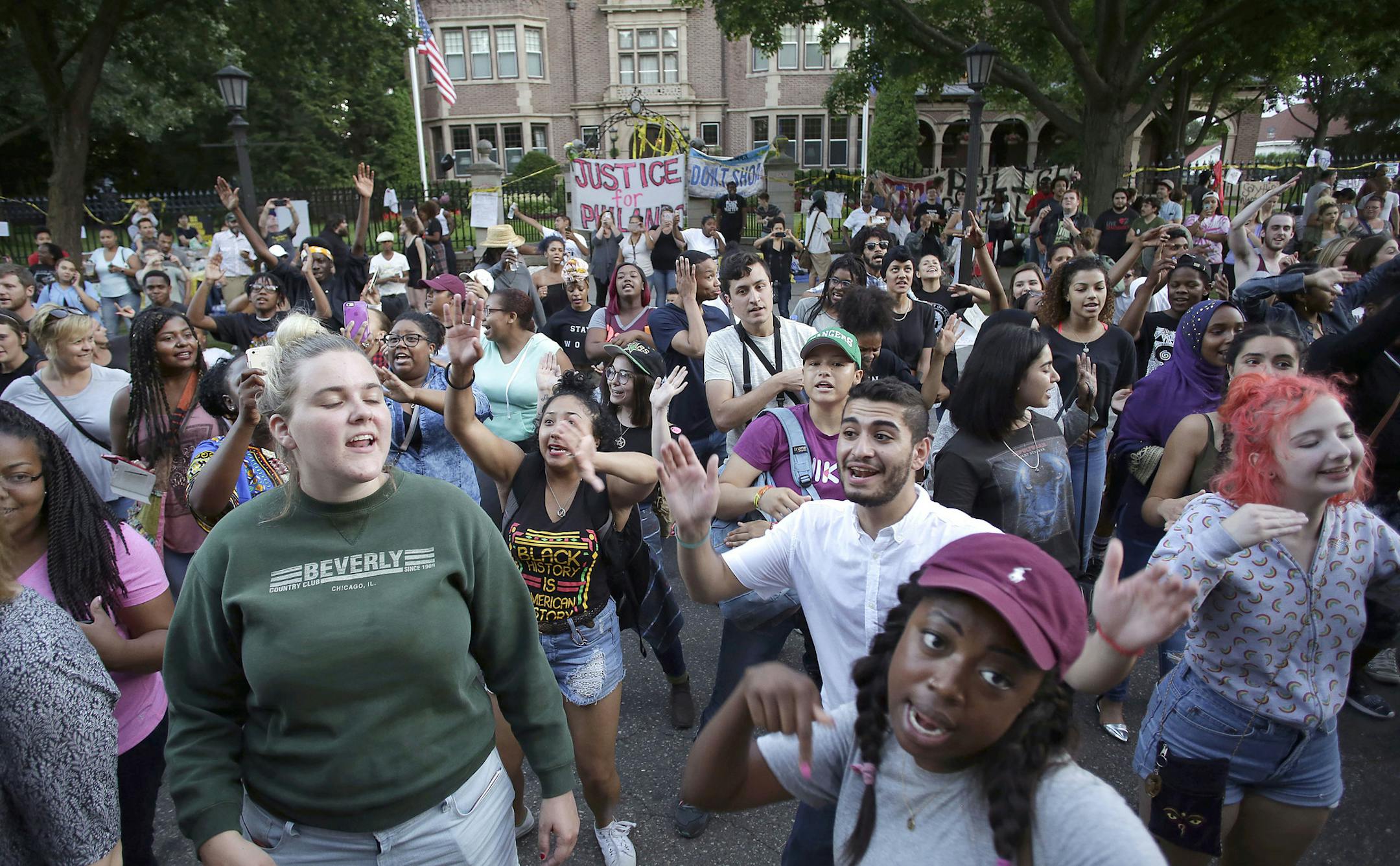 Demonstrators protest the fatal shooting of Philando Castile by dancing outside Gov. Mark Daytonís mansion in Saint Paul, Minn., July 8, 2016. As the United States reeled from a week that brought two high-profile killings of black men by police officers and then a deadly attack on police officers in Dallas, multiple cities saw major protests on Friday night. (Joshua Lott/The New York Times) ORG XMIT: MIN2016070916021207