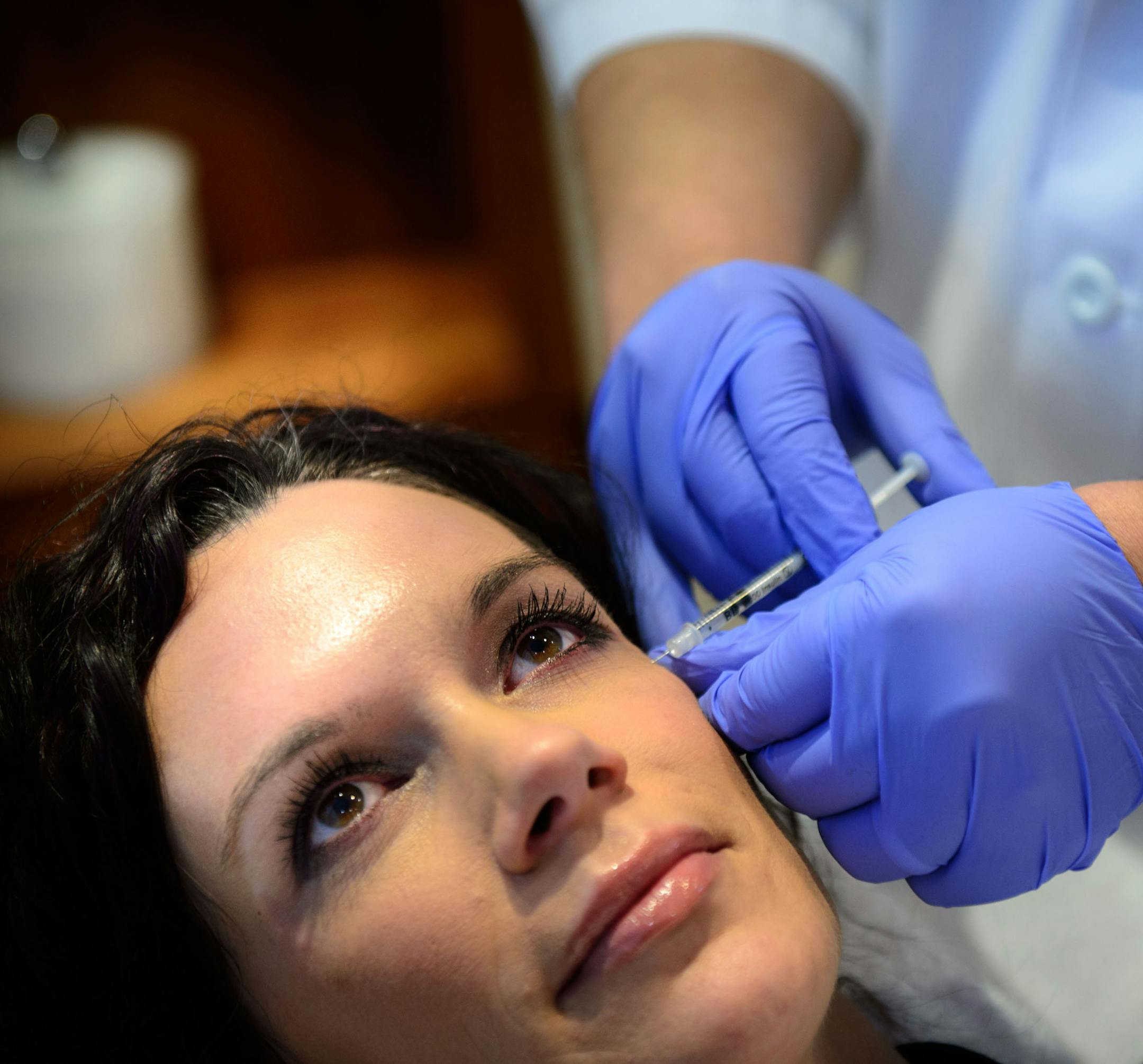 Dr. Charles Crutchfield gave botox injections to Kelly McGuire in his Eagan office of Crutchfield Dermatology on Thursday, Feb. 20, 2014.