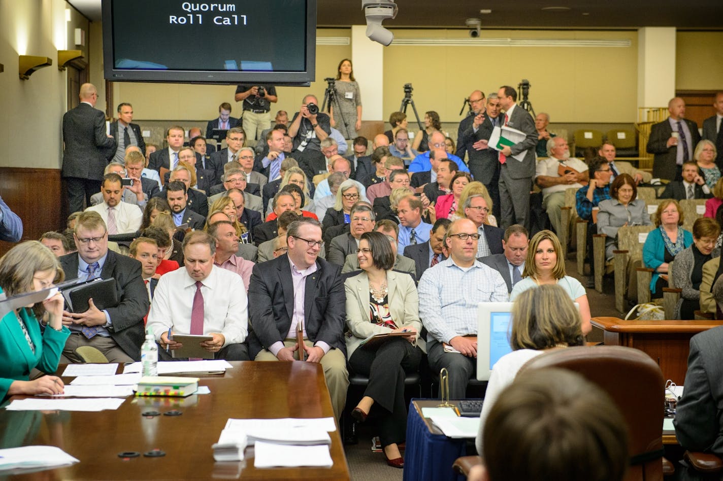 House members were packed into the temporary House Chambers, giving it the feel of a hot high school auditorium.