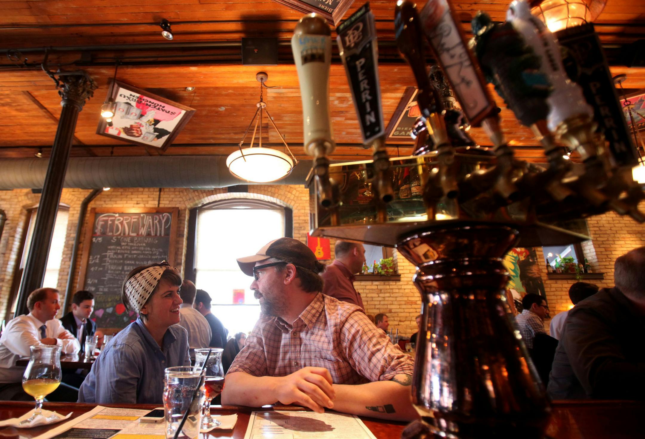 Katie Browne and Matthew Taylor sample beers at Hopcat in Grand Rapids, Michigan, on February 26, 2013. The city has a strong beer culture and many craft brewers. (Andre J. Jackson/Detroit Free Press/MCT) ORG XMIT: 1138774