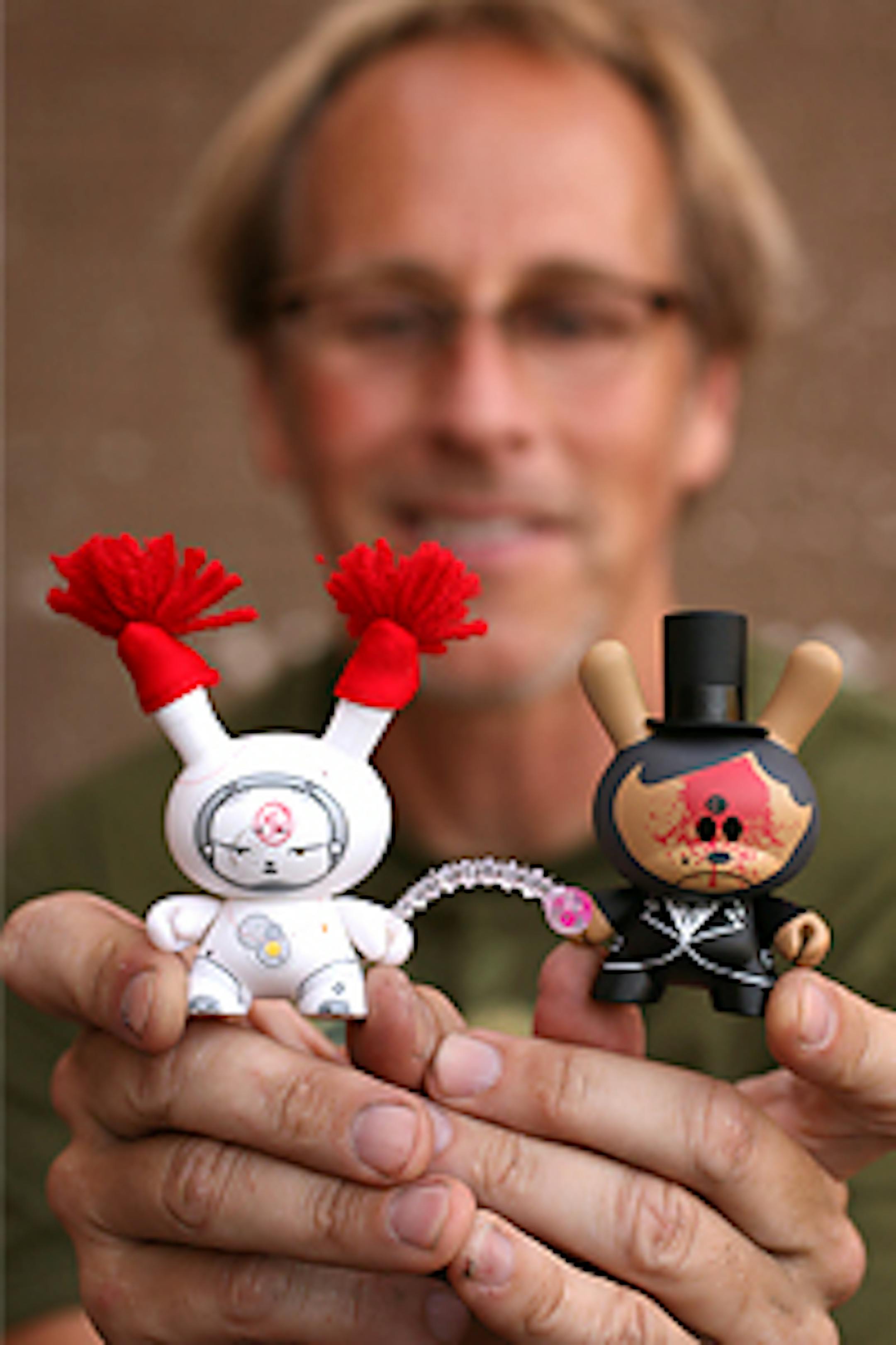 Randy Williams holds Dunny Series 3 toys from ROBOTlove.