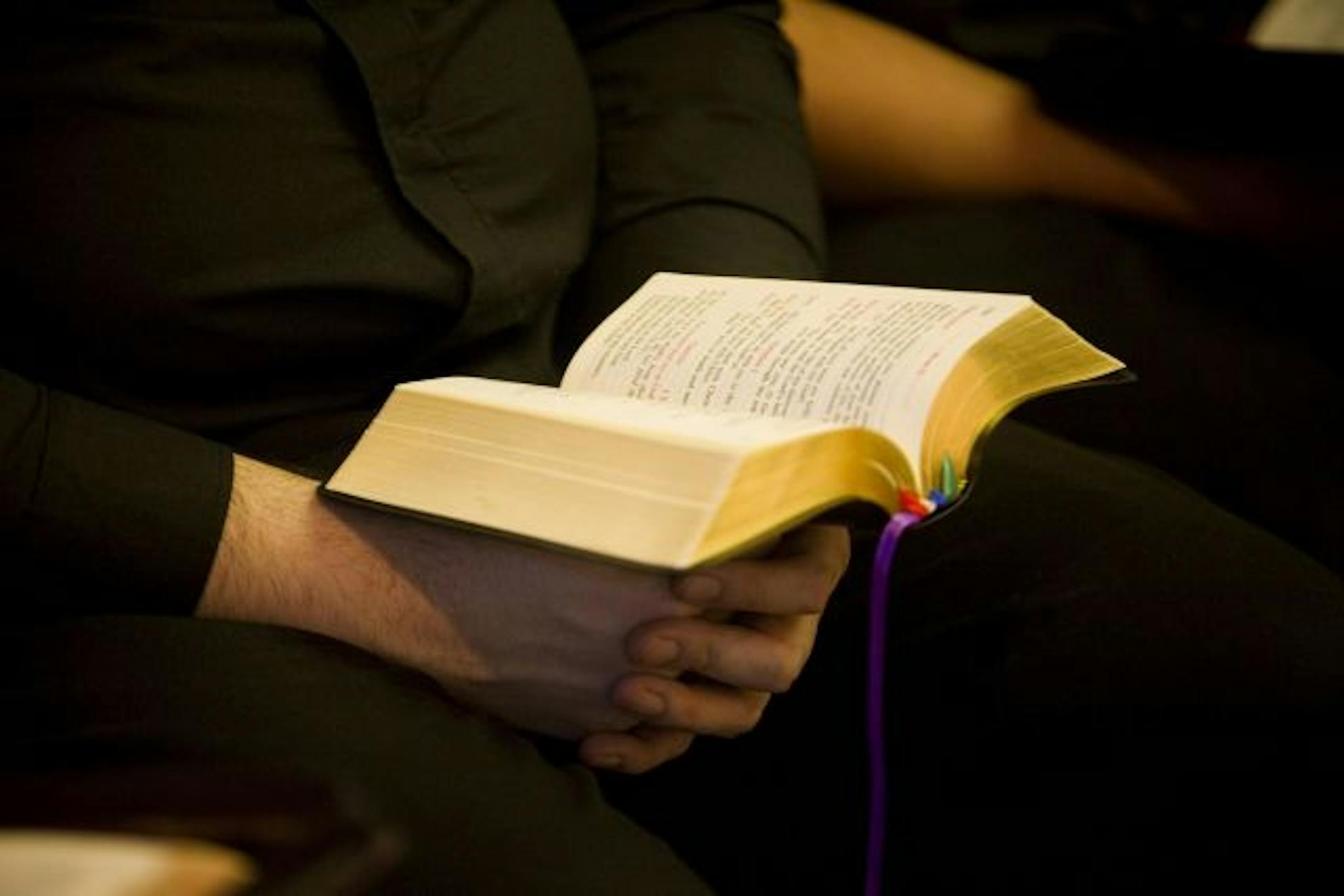 In this photo taken on April 22, 2009, Seminarian Joseph Toledo holds his bible during the morning mass at the Redemptoris Mater Archdiocesan Missionary Seminary in Denver.