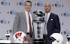 Wisconsin head coach Paul Chryst, left, poses with Penn State head coach James Franklin during a news conference for the Big Ten Conference championsh