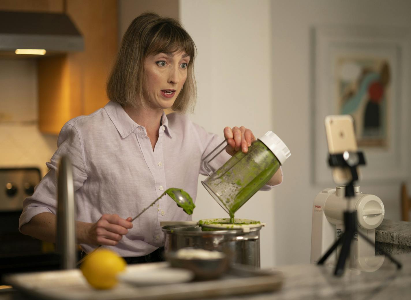 Chef Karyn Tomlinson spoke to the camera while straining pureed asparagus for the soup she was making. ] JEFF WHEELER &#x2022; Jeff.Wheeler@startribune.com Since the pandemic began, former Corner Table chef Karyn Tomlinson has been a prolific poster to Instagram, offering free cooking lessons with her show "Karyn's Quarantine Kitchen." She's gotten very efficient, filming and editing all her videos on just her iPhone. She was photographed producing a segment on preparing pureed soups Thursday af