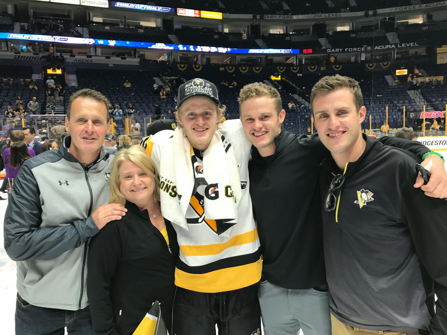 Penguins center Jake Guentzel gathered on the Bridgestone Arena ice with his family after Pittsburgh's 2-0 Game 6, Stanley Cup-clinching victory over the Predators in Nashville on Sunday. From left: parents Mike and Sally, Jake, brothers Gabe and Ryan.