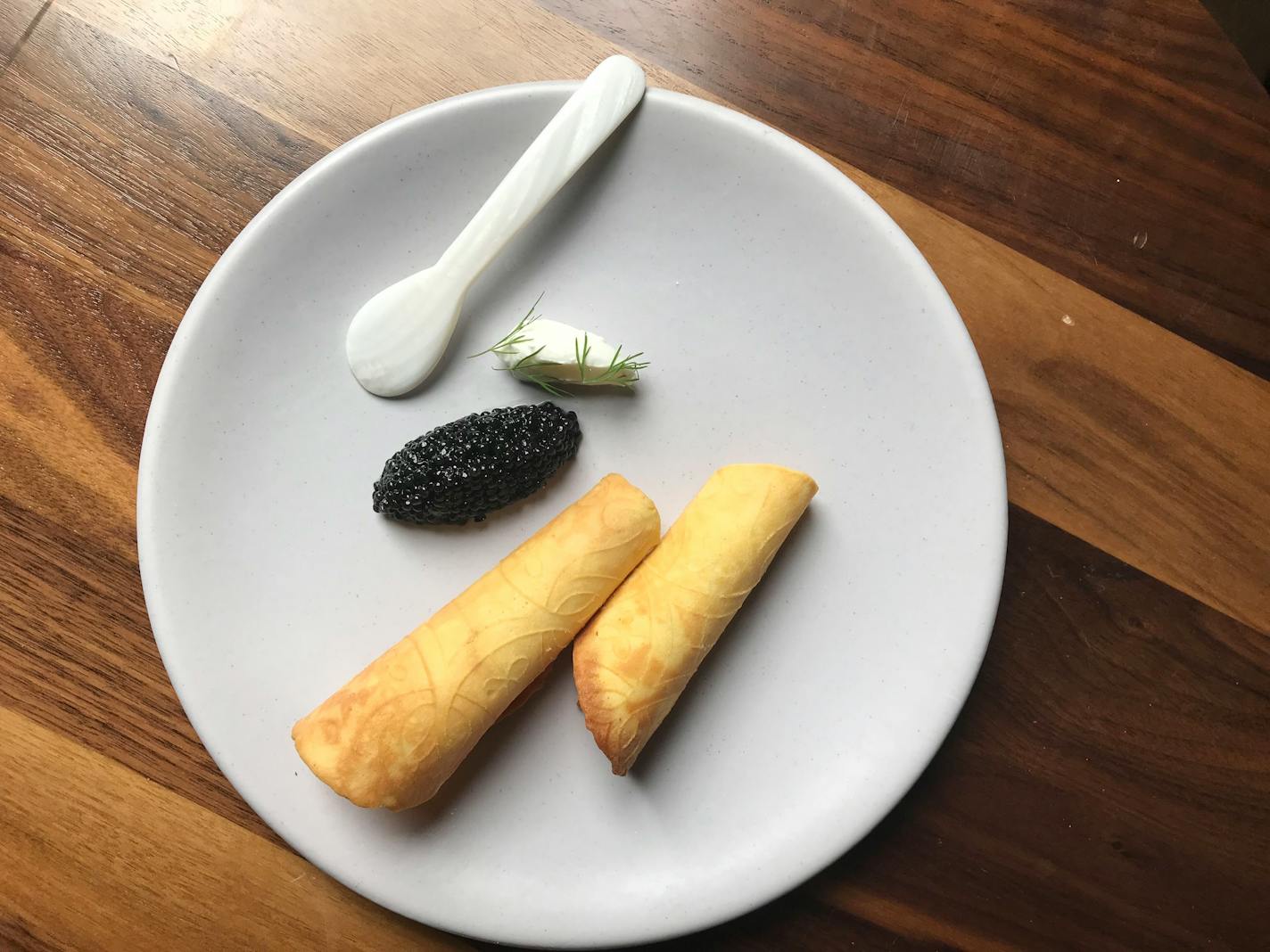 The restaurant's name is Norwegian for "water." Above, krumkake and caviar.