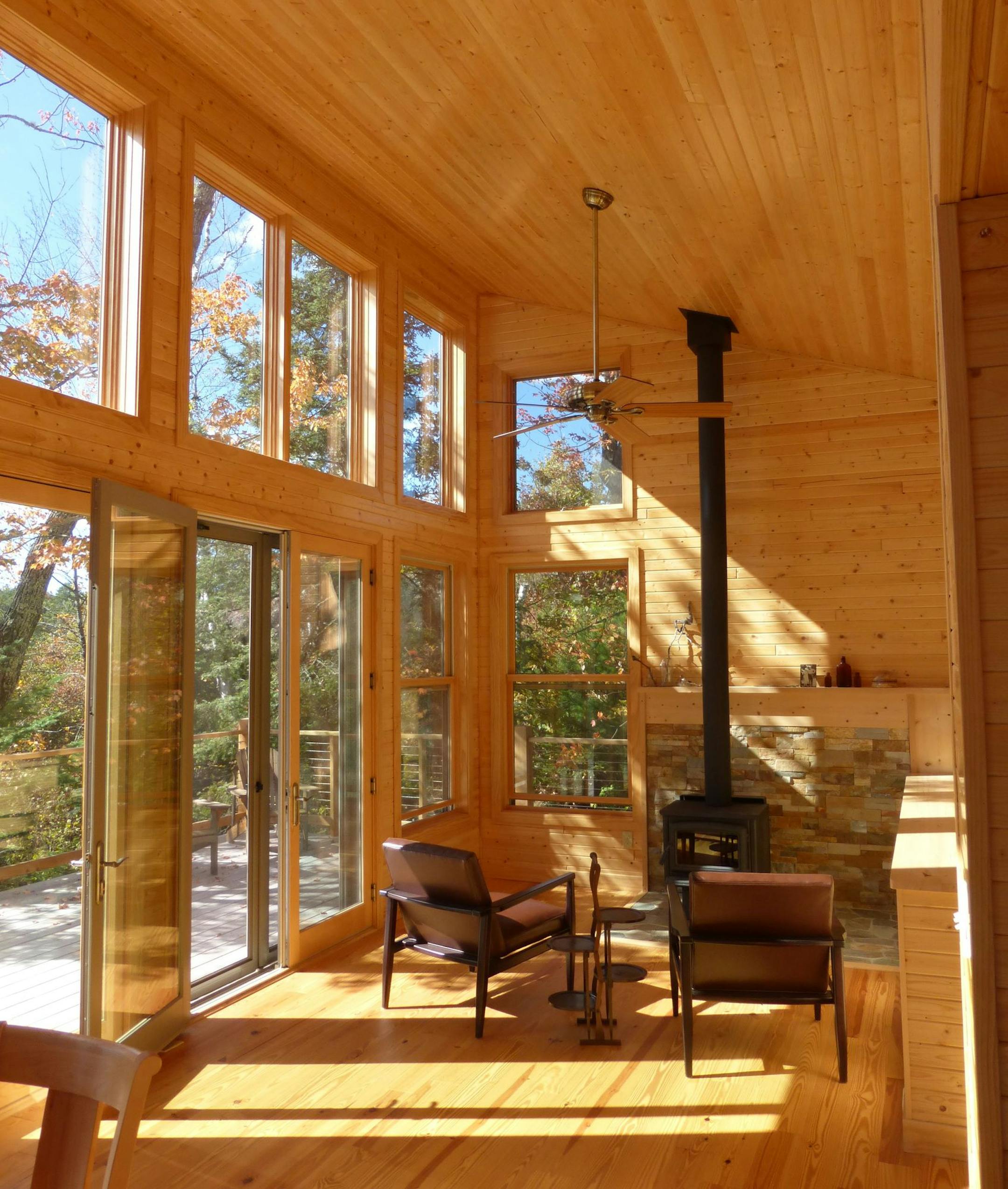 The tall wall of windows faces south for warmth and light.