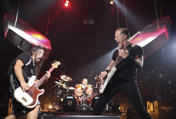 Metallica frontman James Hetfield, right, with bassist Rob Trujillo and drummer Lars Ulrich, were last in town at Target Center in 2009.