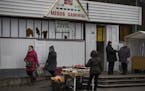 People meet and chat at a market in Visaginas, a Lithuanian town heavily populated by ethnic Russians, some 150 km (93 miles) northeast of the capital