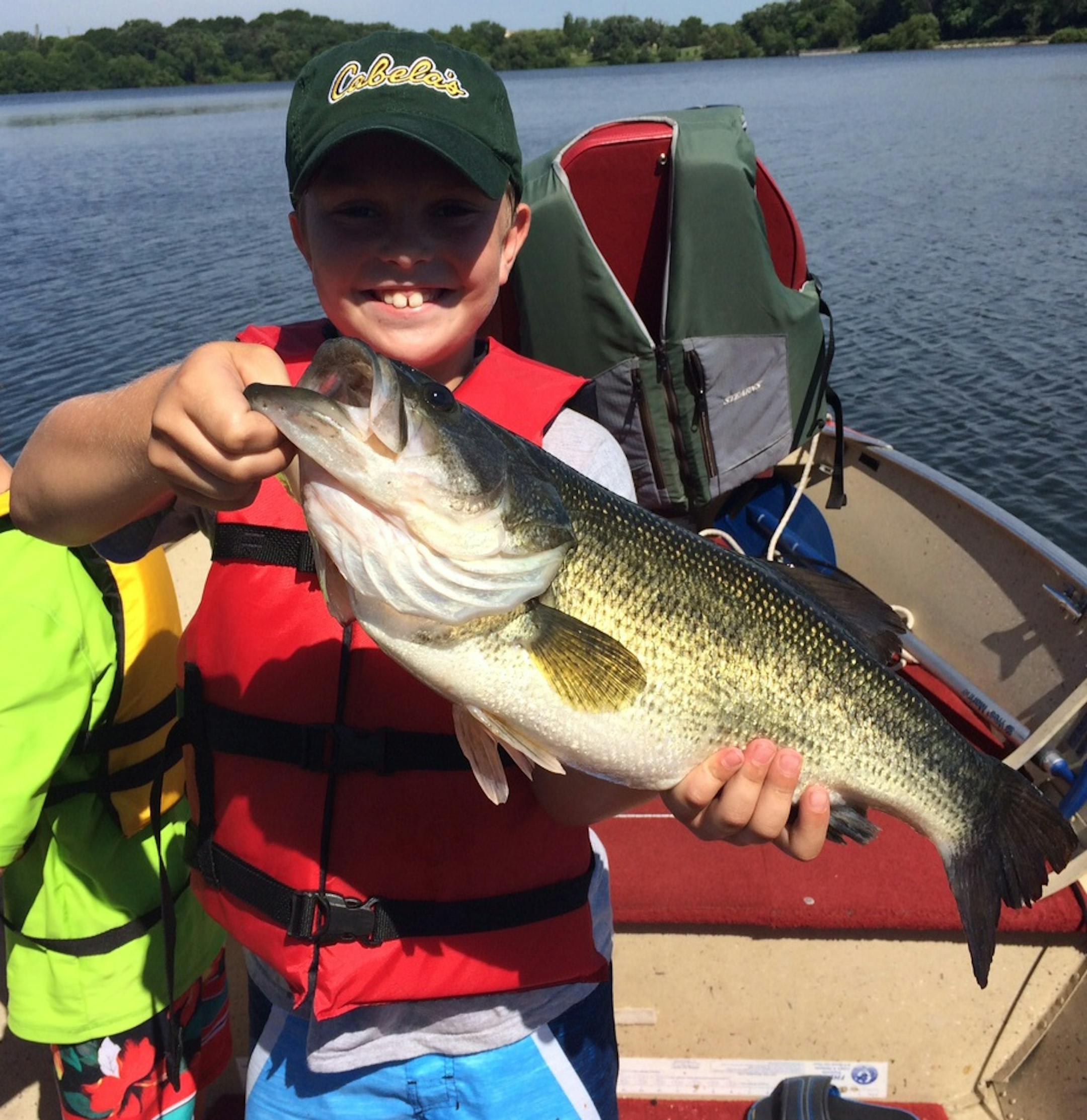 turner Koltnow, 9, Eden Prairie, caught this 20Ω-inch bass while fishing with his brother and grandfather. The bass was caught on a metropolitan area lake using a Chigger Craw. He released the catch.