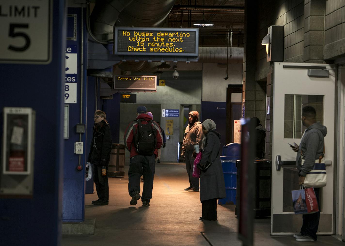 People wait for buses at the Mall of America transit station in Bloomington November 27, 2015. The station serves both bus and light rail passengers. (Courtney Perry/Special to the Star Tribune)