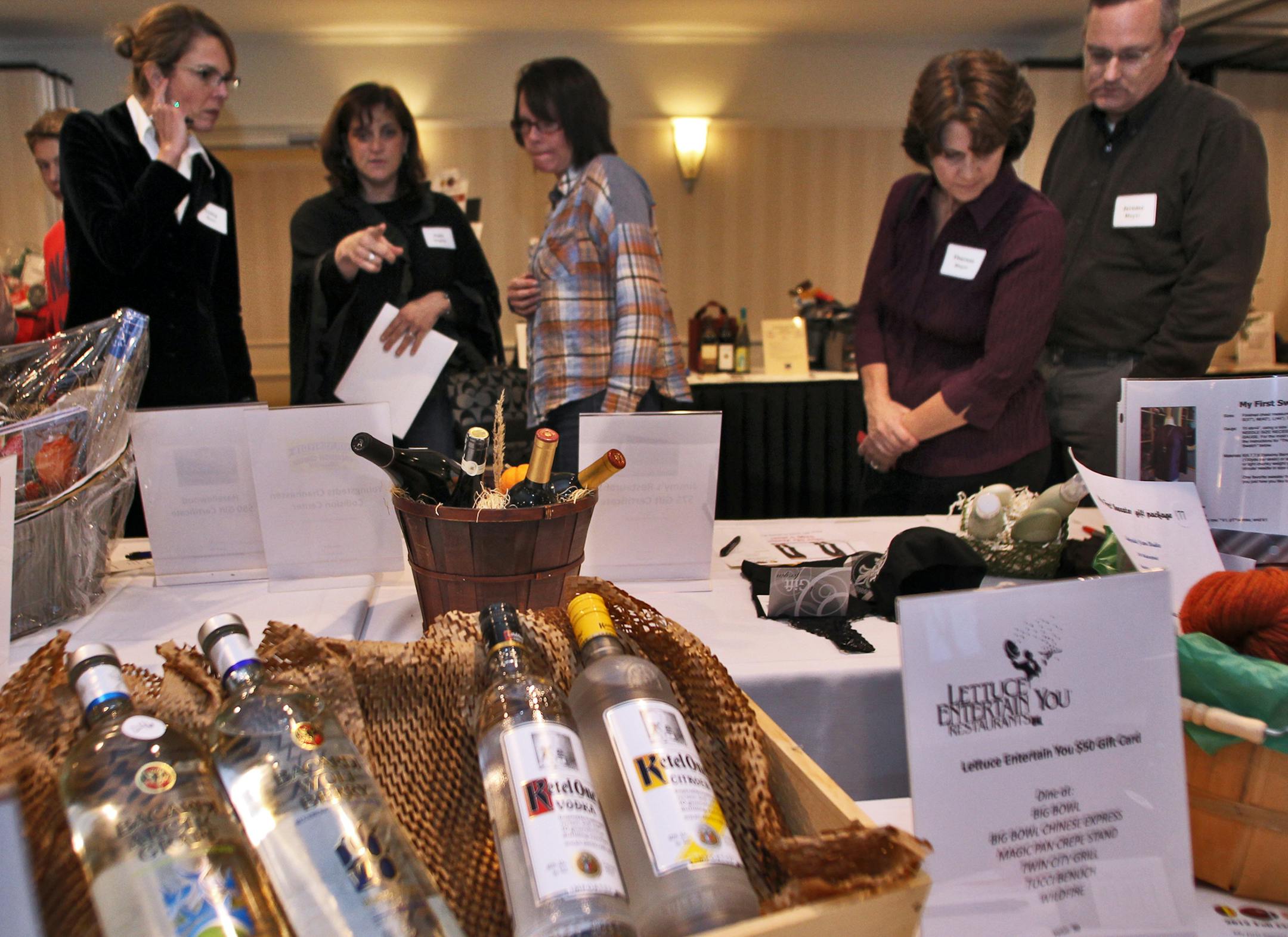 The Minnetonka Diamond Club, a Minnetonka sports booster organization, held a fund-raising auction at Bayview Event Center in Excelsior. Booster club members checked out items offered in a silent auction. (MARLIN LEVISON/STARTRIBUNE(mlevison@startribune.com (cq -