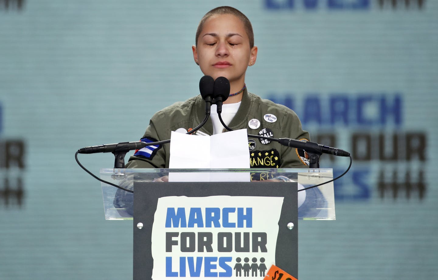 Emma Gonzalez, a survivor of the mass shooting at Marjory Stoneman Douglas High School in Parkland, Fla., closes her eyes and cries as she stands silently at the podium for the amount of time it took the Parkland shooter to go on his killing spree during the "March for Our Lives" rally in support of gun control in Washington, Saturday, March 24, 2018. (AP Photo/Alex Brandon)