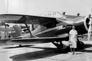 May 30, 1937 Mrs. Louise Thaden, winner of the Bendix and Harmon Trophies last year, beside the plane in which she set a new speed record for women at