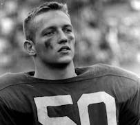 Center Greg Larson captained the Gophers to a national championship in 1960 before going on to a long NFL career with the New York Giants.